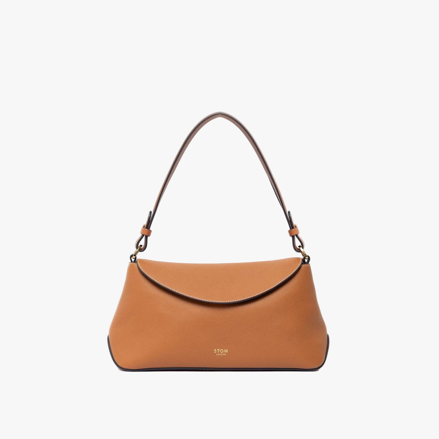 STOW London's East West and detachable shoulder strap in Earth Tan leather on a light grey background featuring gold hardware and details