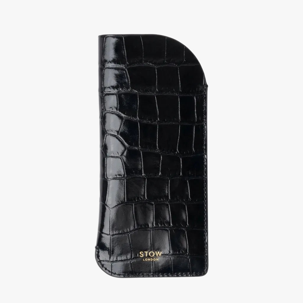 STOW London's Glasses Case in Burgundy Embossed Croc leather, featuring a gold logo on a light background