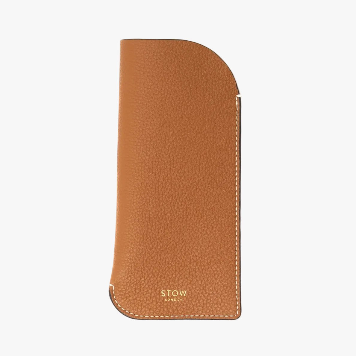 STOW London's Glasses Case in Earth Tan pebbled leather on a light grey background with a small logo on the bottom
