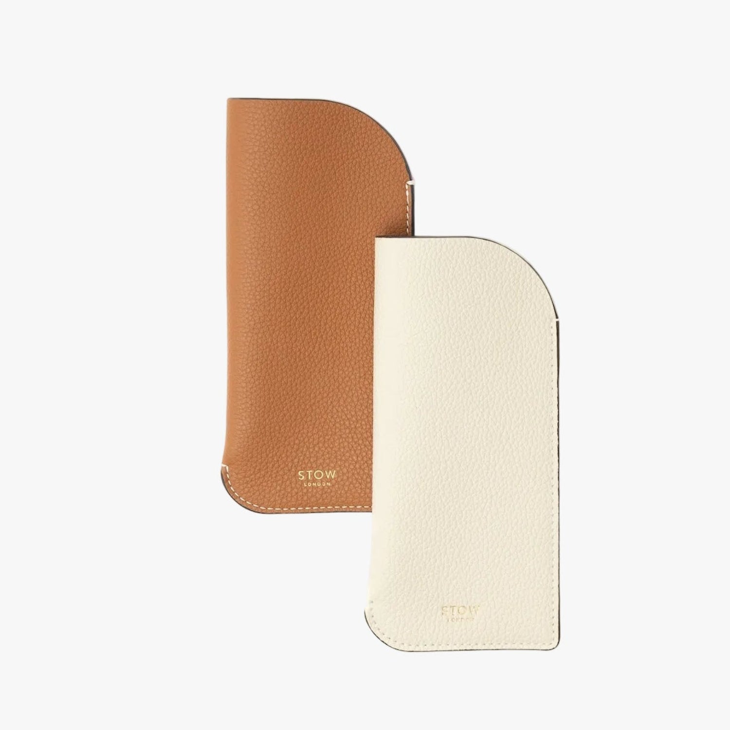 Shot of the Earth Tan and Spring Moon Glasses Cases from STOW London featuring gold logos on a white background