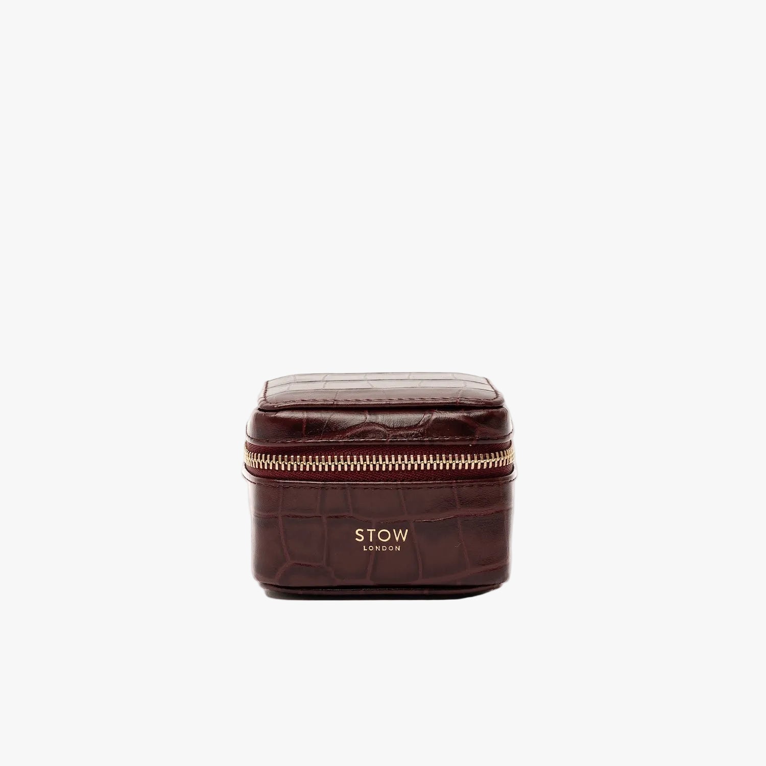 STOW London's Hester Jewellery Case in Burgundy Embossed Croc leather on a light grey background featuring a YKK Natulon zip and fine gold embossed logo on the front