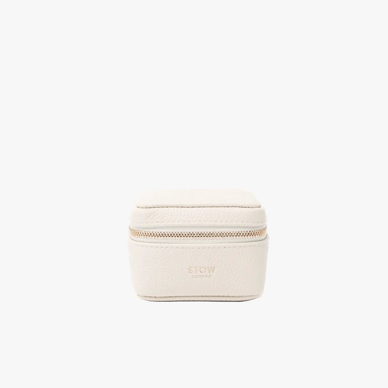STOW London's Hester Jewellery Case in Spring Moon pebbled leather on a light grey background featuring a YKK Natulon zip and fine gold embossed logo on the front