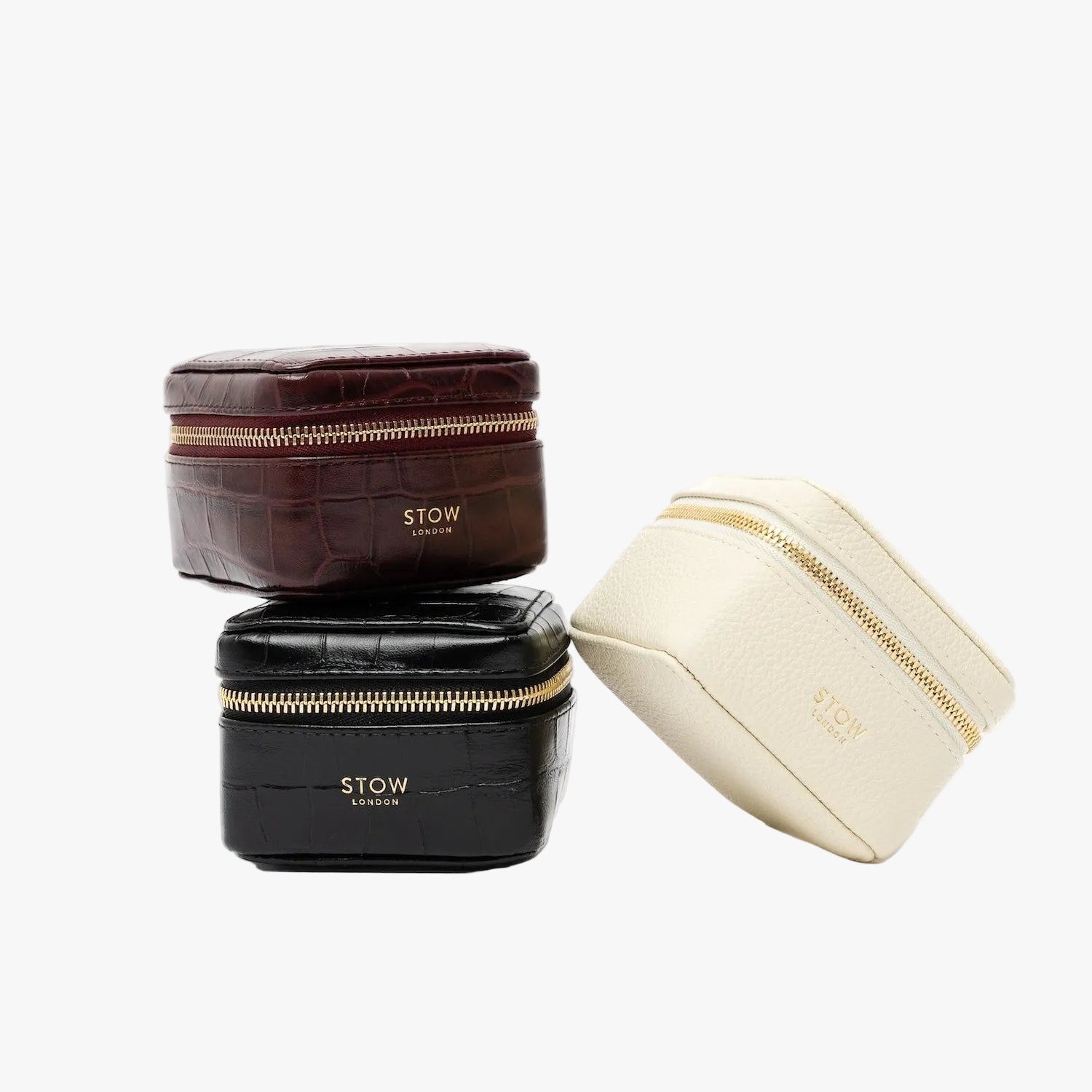 STOW London's Hester Jewellery Cases in Embossed Croc and Pebbled leather on a light grey background