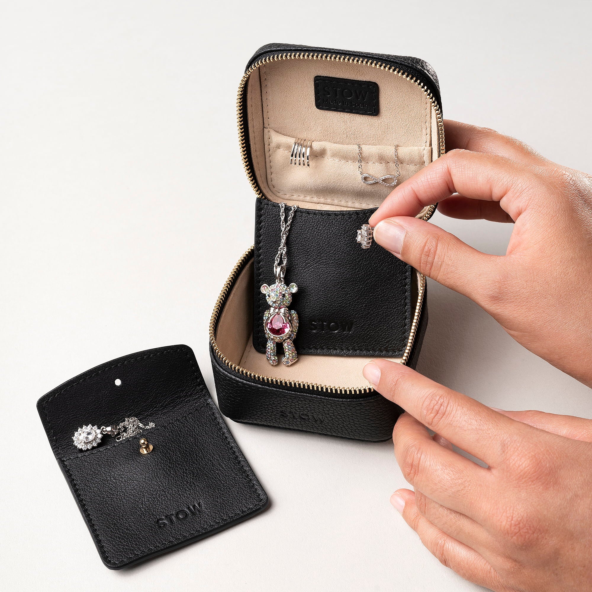 STOW London Hester Essentials Case in Black leather showing interior with two leather sleeves included