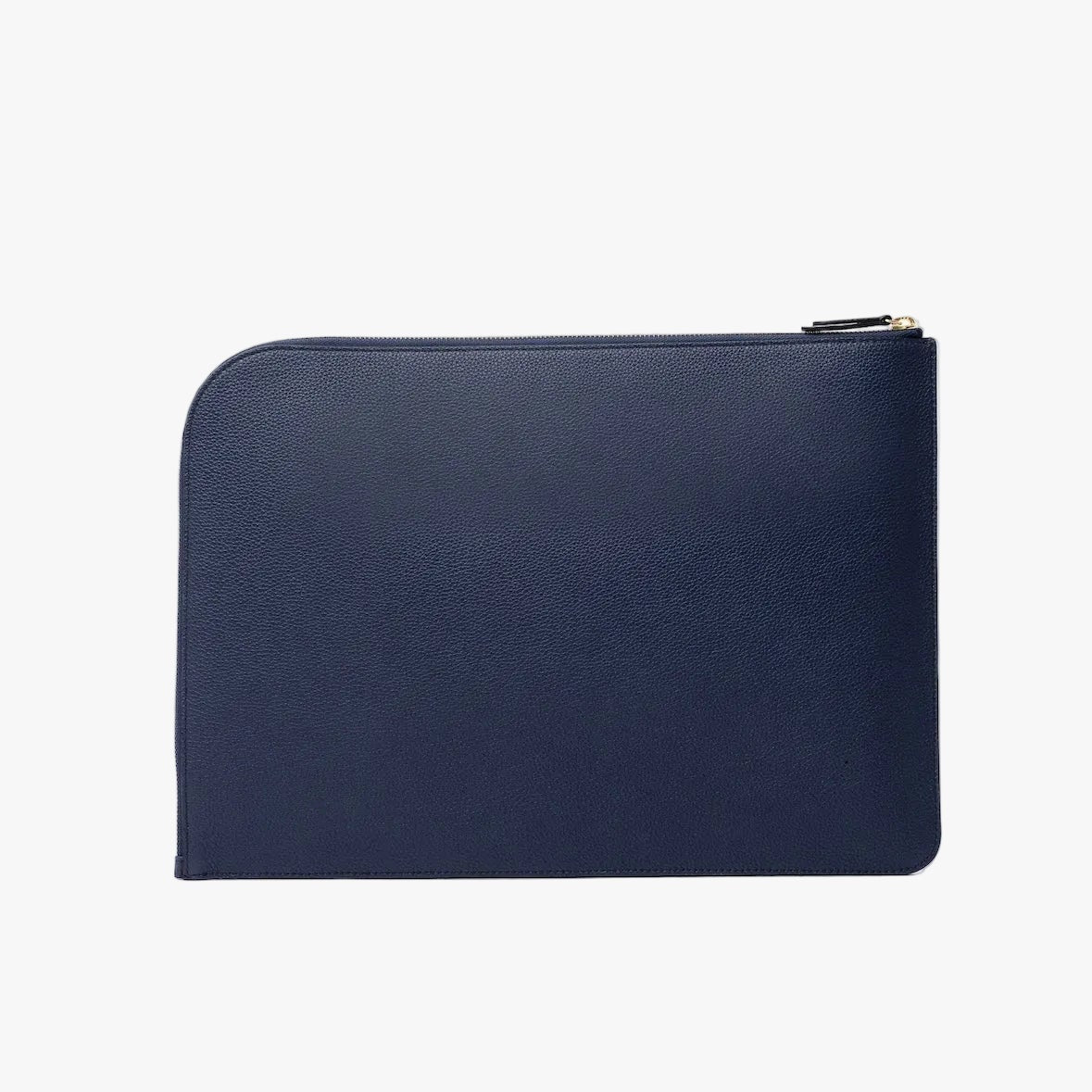 Back panel of STOW London's Laptop Sleeve in Navy pebbled leather on a light grey background featuring a YKK Natulon Zip