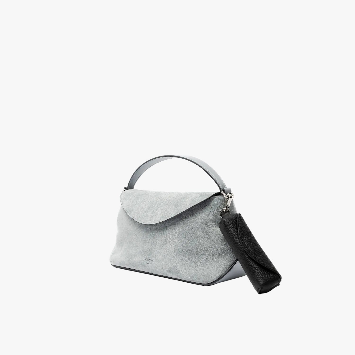 STOW London's Lipstick Case in Black pebbled leather attached to the Mini East West in Misty Blue suede featuring a silver stainless steel clip on a light grey background