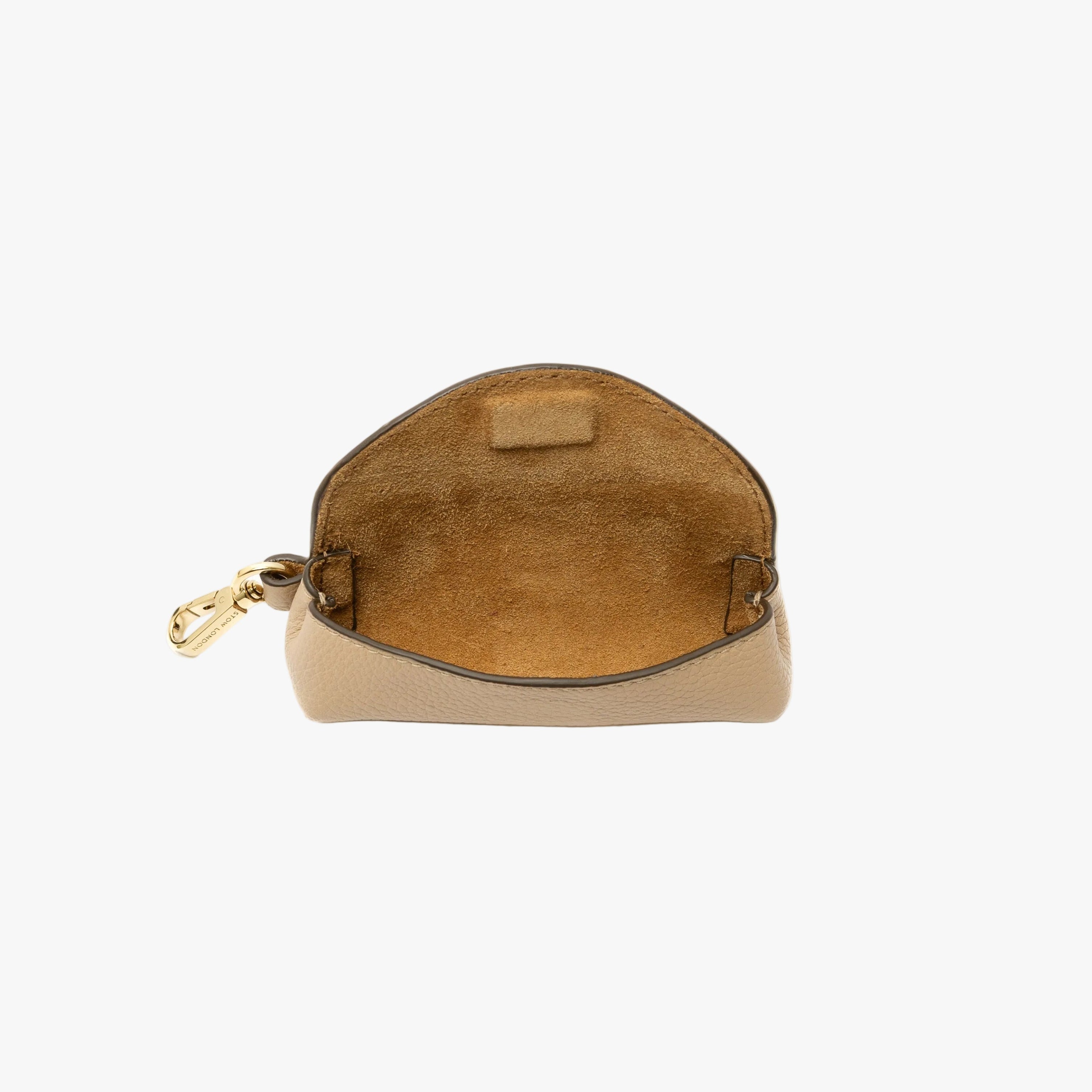 STOW London's Lipstick Case in Camel pebbled leather on a light grey background with flap open showing hidden magnet and suede interior lining featuring gold-coated stainless steel hardware