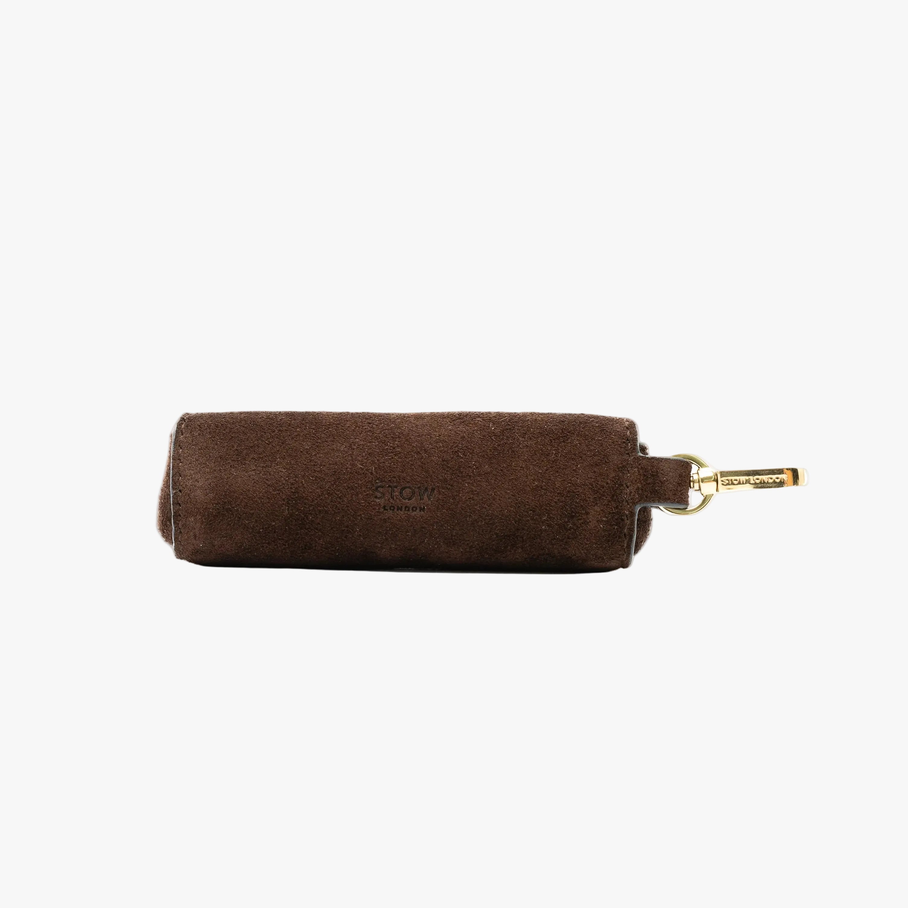 STOW London's Lipstick Case in Chocolate suede leather on a light grey background featuring a gold-coated stainless steel clip