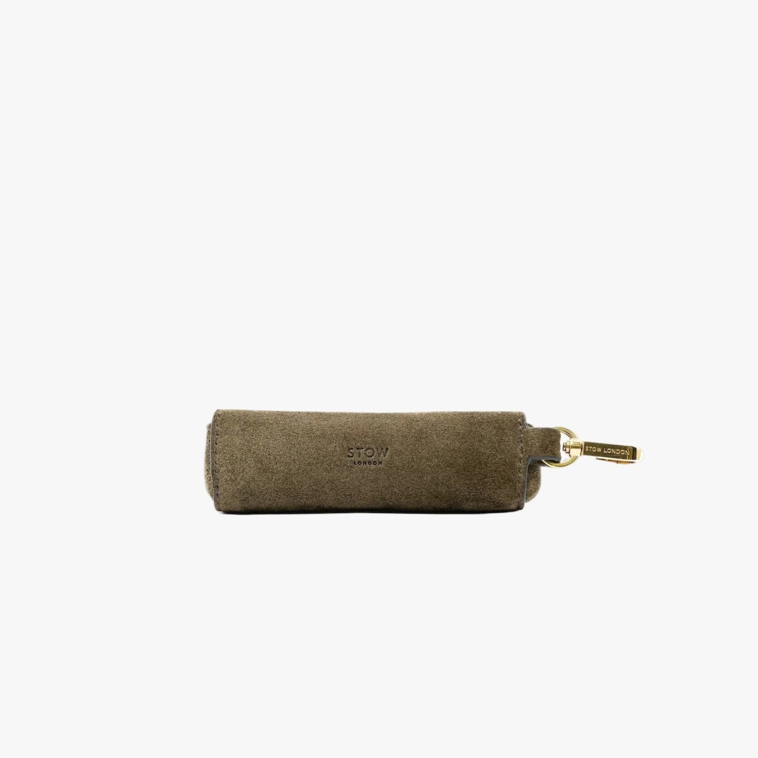 STOW London's Lipstick Case in Dark Green suede leather on a light grey background featuring a gold-coated stainless steel clip