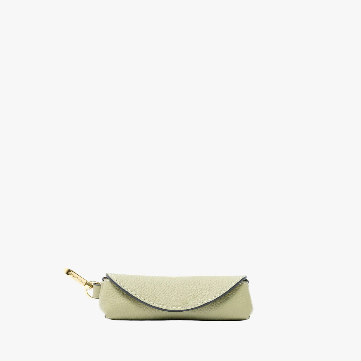 STOW London's Lipstick Case in Pale Green pebbled leather featuring a gold-coated stainless steel clip on a light grey background