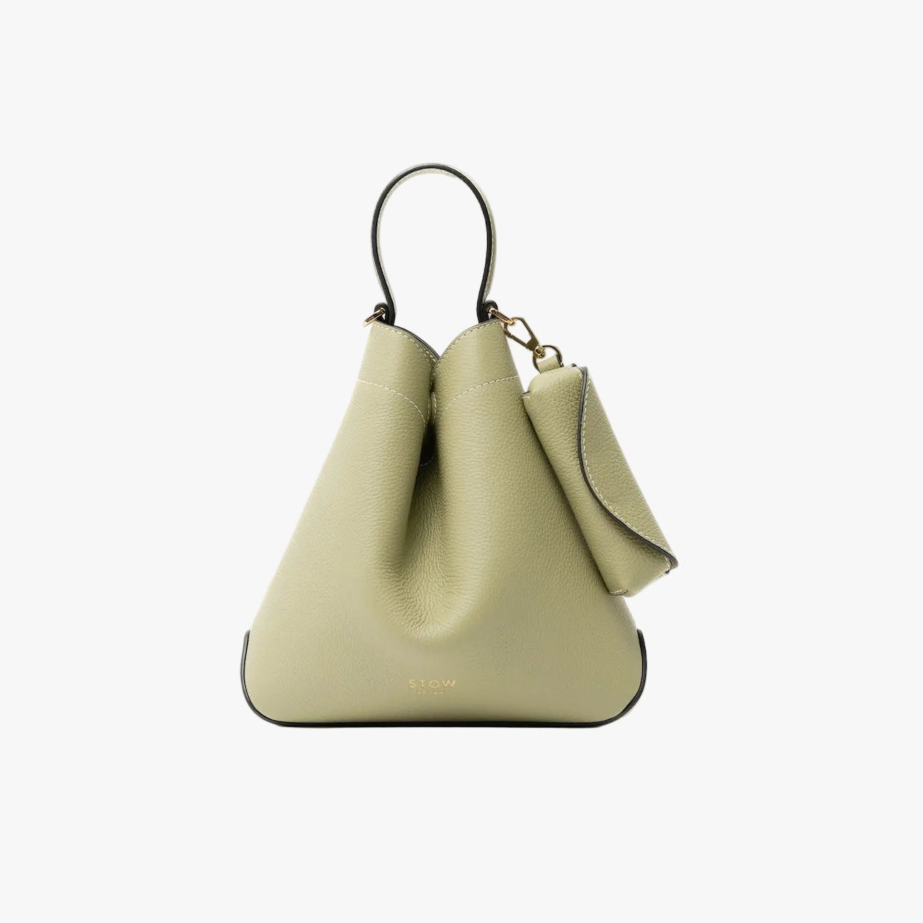STOW London's Lipstick Case in Pale Green pebbled leather attached to the matching Mini Curve bag featuring a gold-coated stainless steel clip on a light grey background