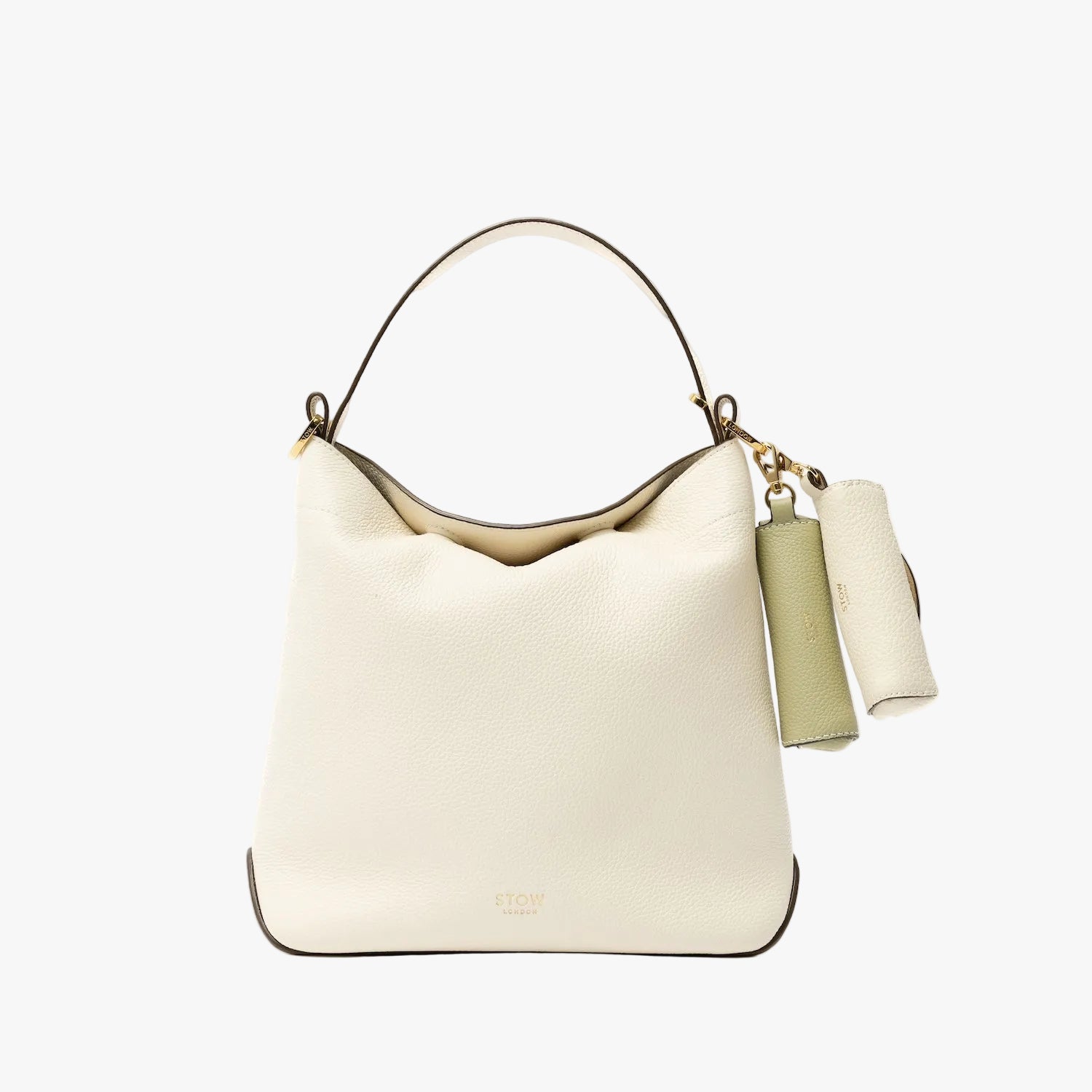 STOW London's Lipstick Case in Green pebbled leather attached to the Spring Moon Midi Curve in alongside the Spring Moon lipstick case on a light grey background featuring a gold-coated stainless steel clip
