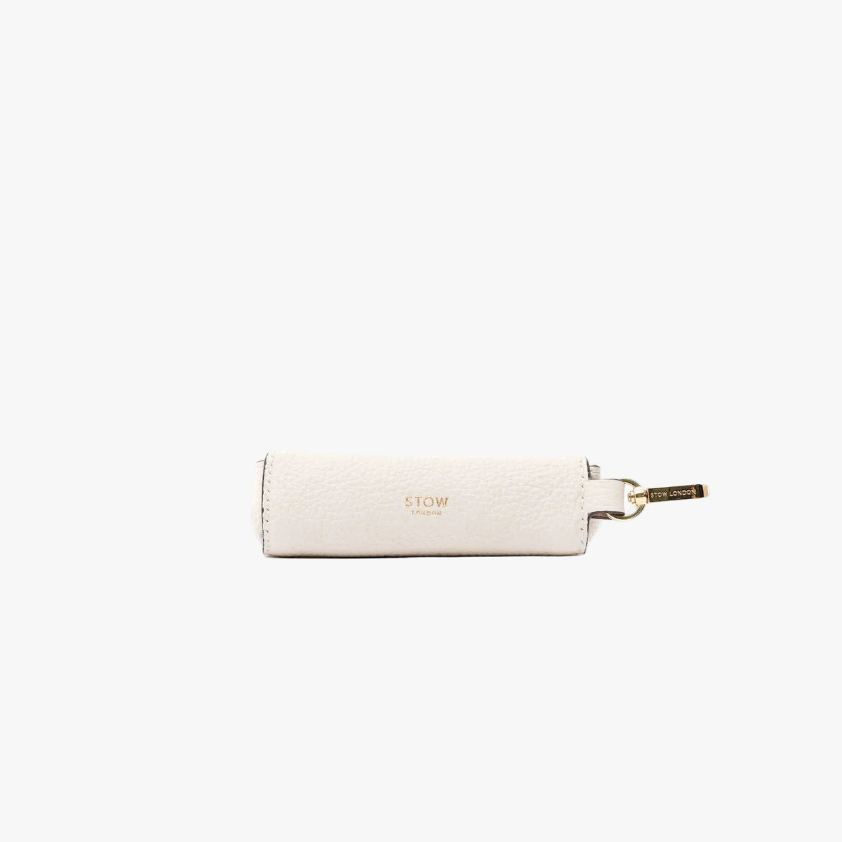 STOW London's Lipstick Case in Spring Moon pebbled leather featuring a gold-coated stainless steel clip and gold logo on a light grey background