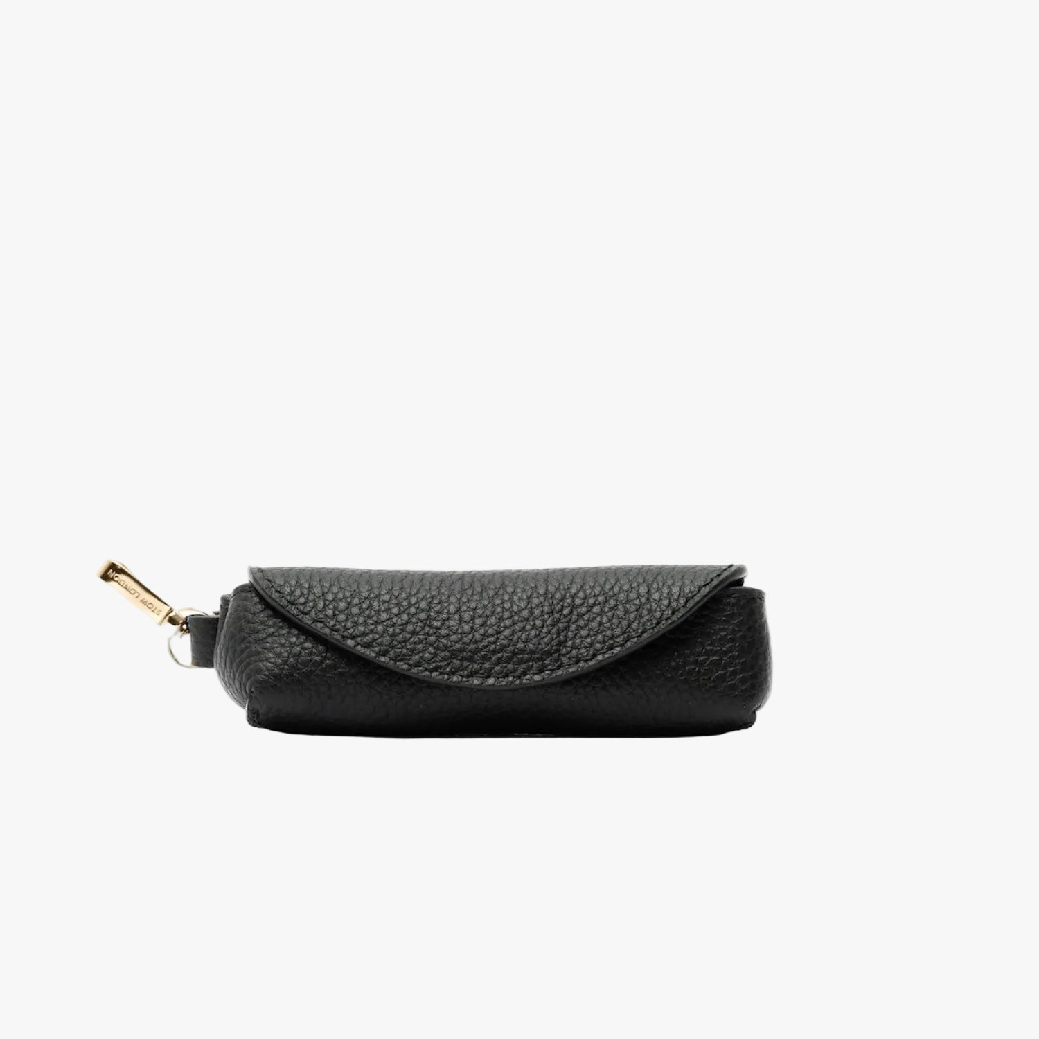 STOW London's Lipstick Case in Black pebbled leather featuring a gold-coated stainless steel clip on a light grey background