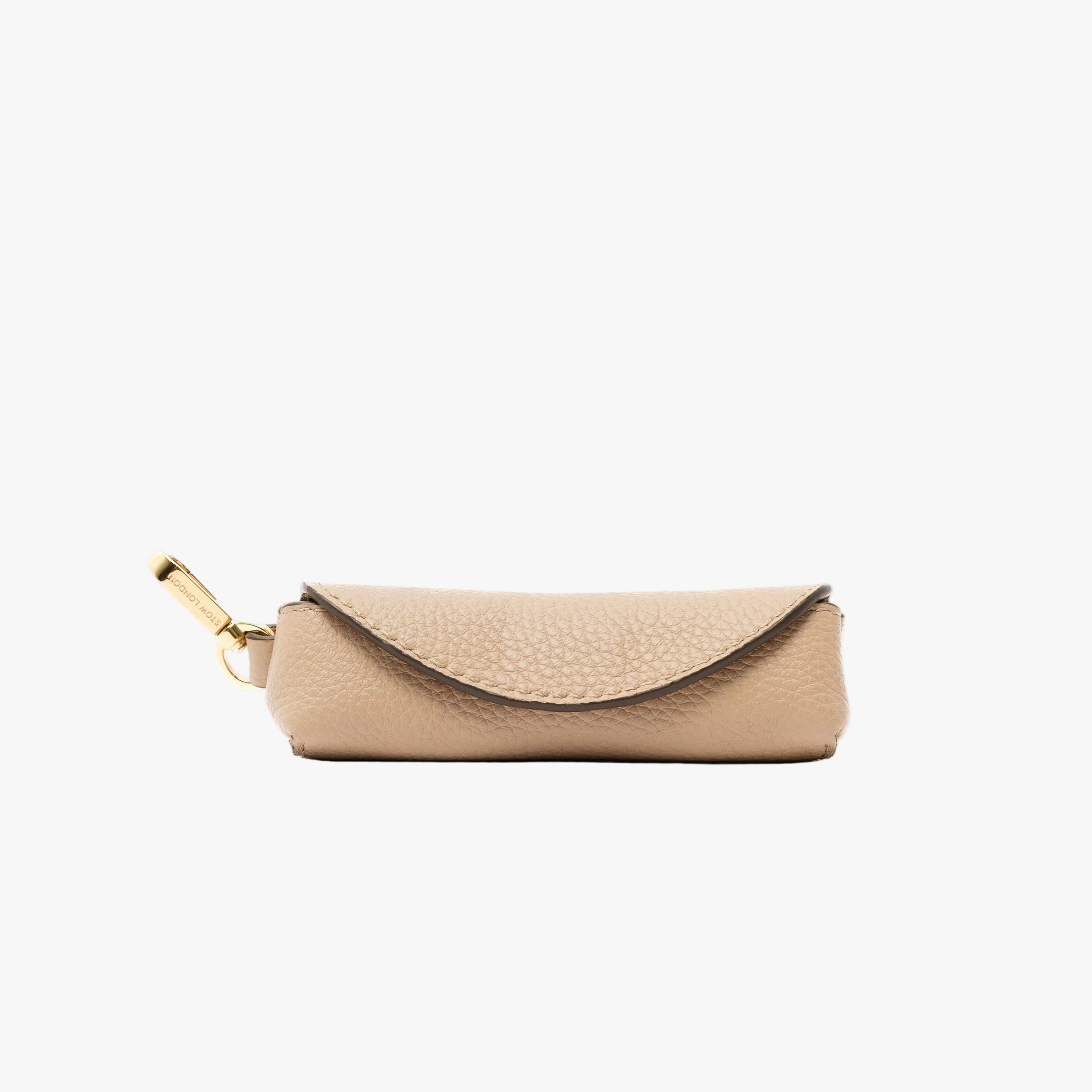 STOW London's Lipstick Case in Camel pebbled leather featuring a gold-coated stainless steel clip on a light grey background