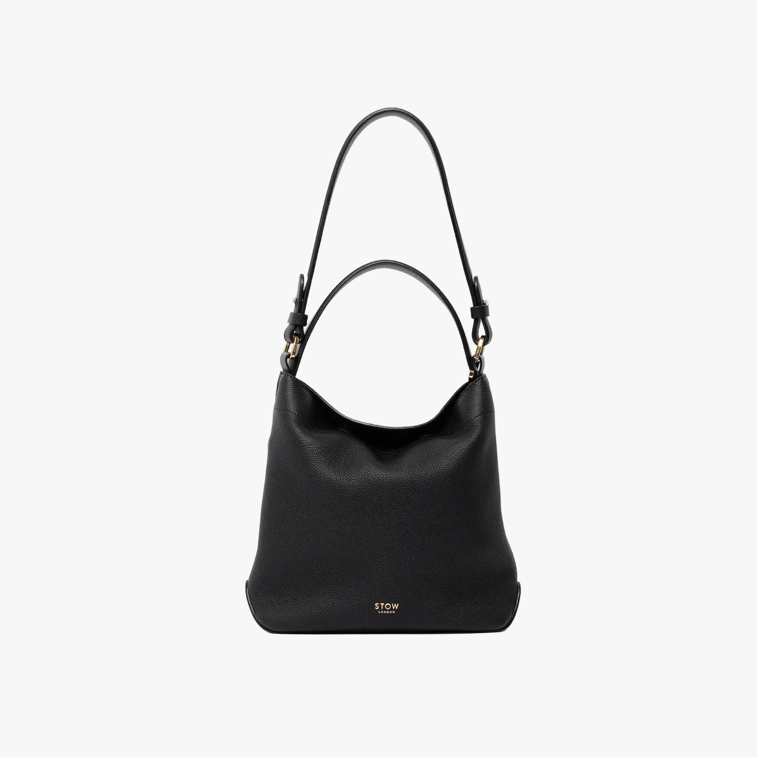 STOW London's Midi Curve and detachable shoulder strap and top handle in Black leather out on a light grey background featuring gold hardware and details