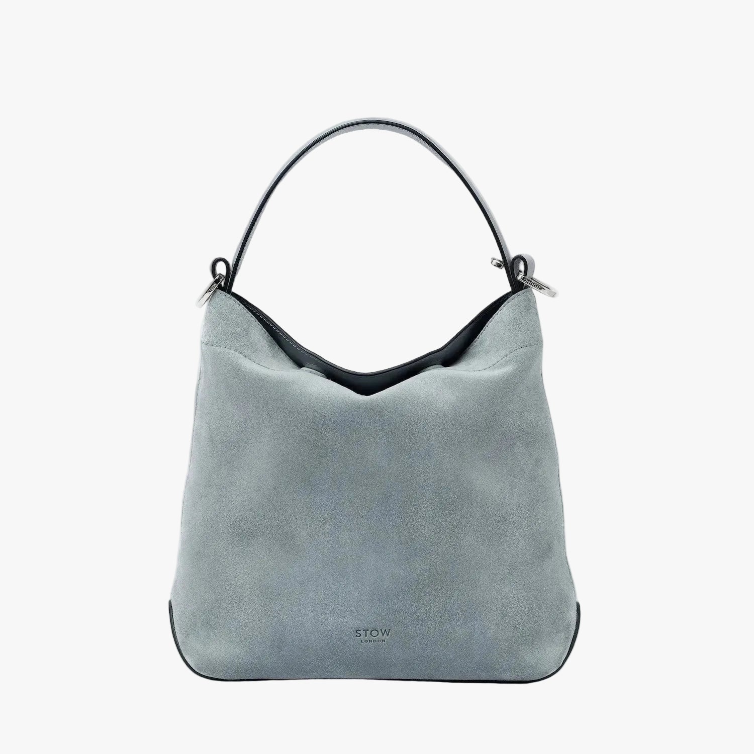 STOW London's Midi Curve in Misty Blue suede leather styled as a flap bag featuring silver stainless steel hardware on a light grey background