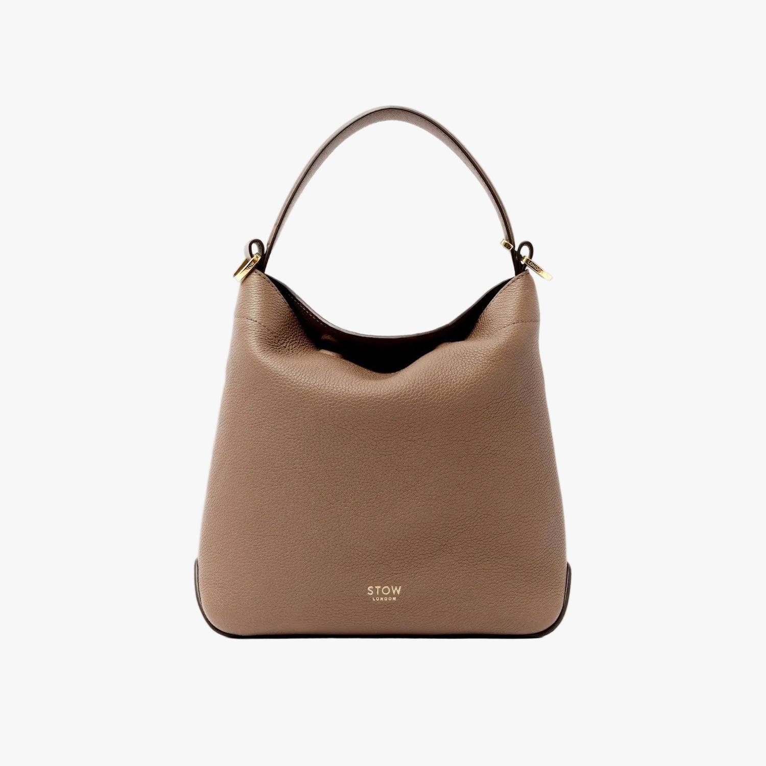 STOW London's Midi Curve bag in Mocha pebbled leather styled as a flap bag featuring gold-coated stainless steel hardware on a light grey background