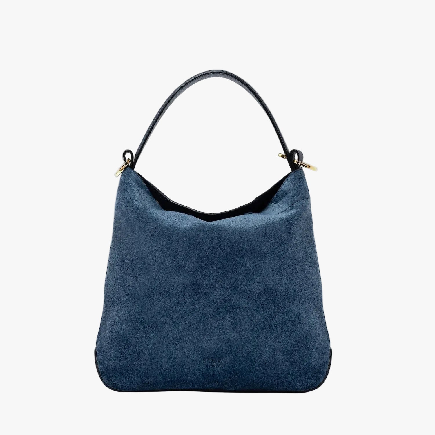 STOW London's Midi Curve in Navy suede leather styled as a flap bag featuring gold-coated stainless steel hardware on a light grey background