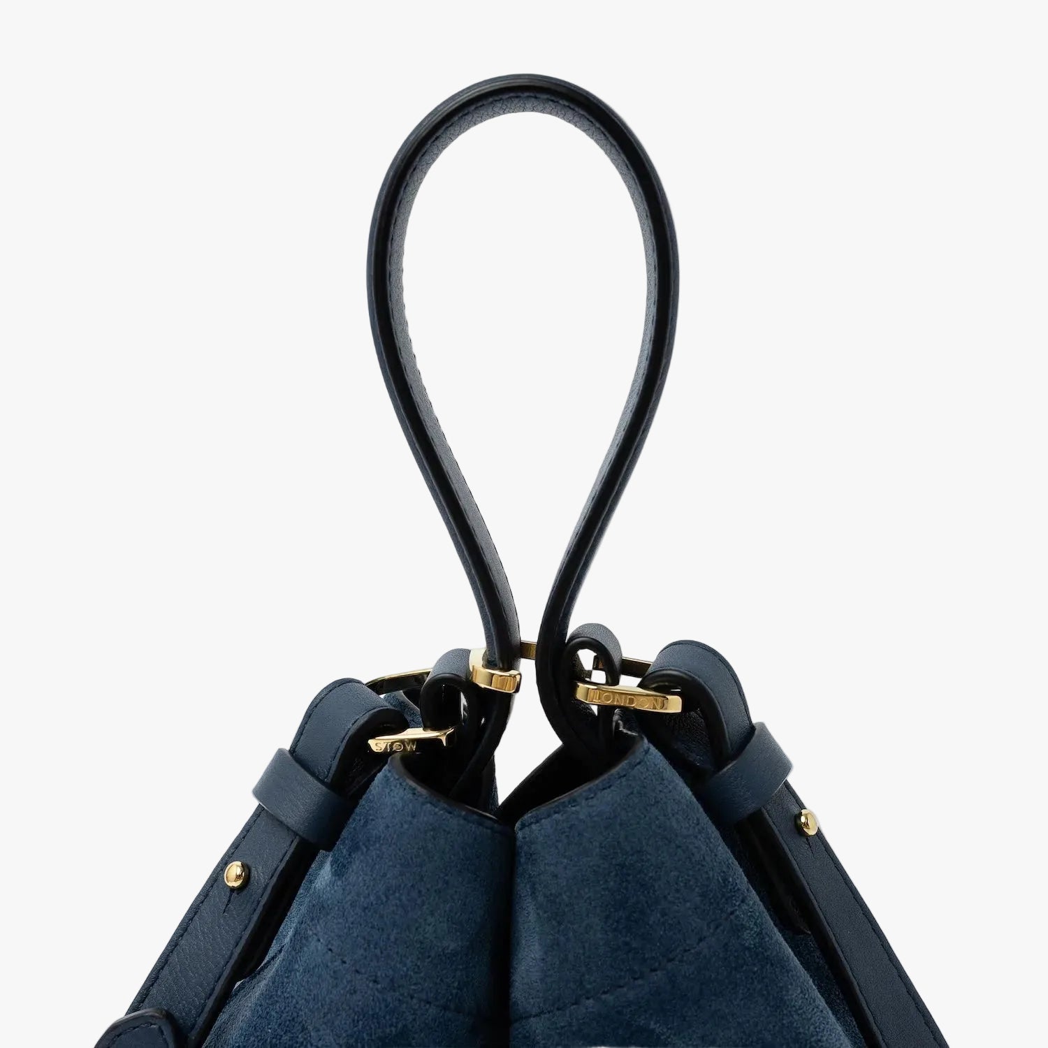 Close up of the handle on STOW London's Midi Curve in Navy suede leather featuring gold-coated stainless steel hardware, clip and detachable crossbody strap on a light grey background