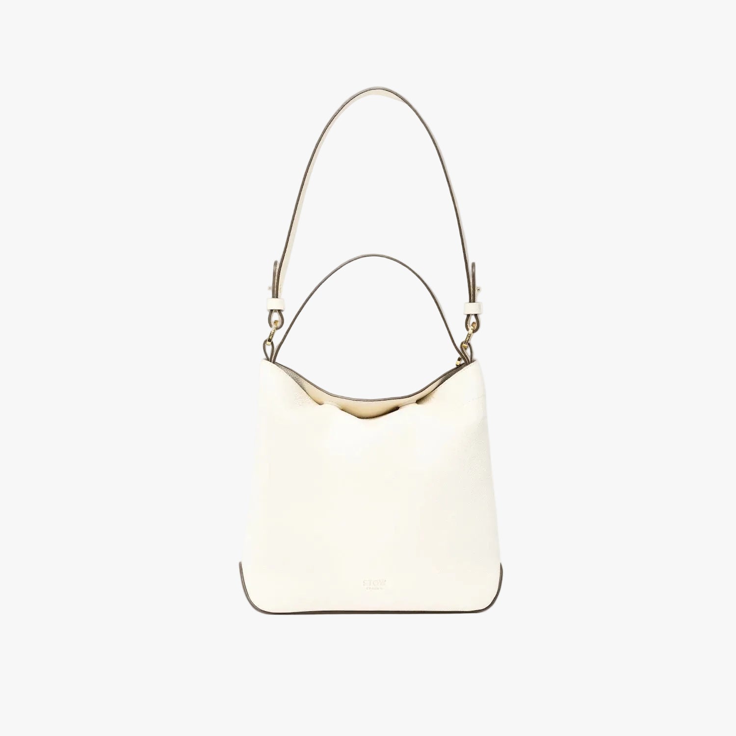 STOW London's Midi Curve in Spring Moon leather on a light grey background featuring the detachable shoulder strap and top handle with gold hardware and details