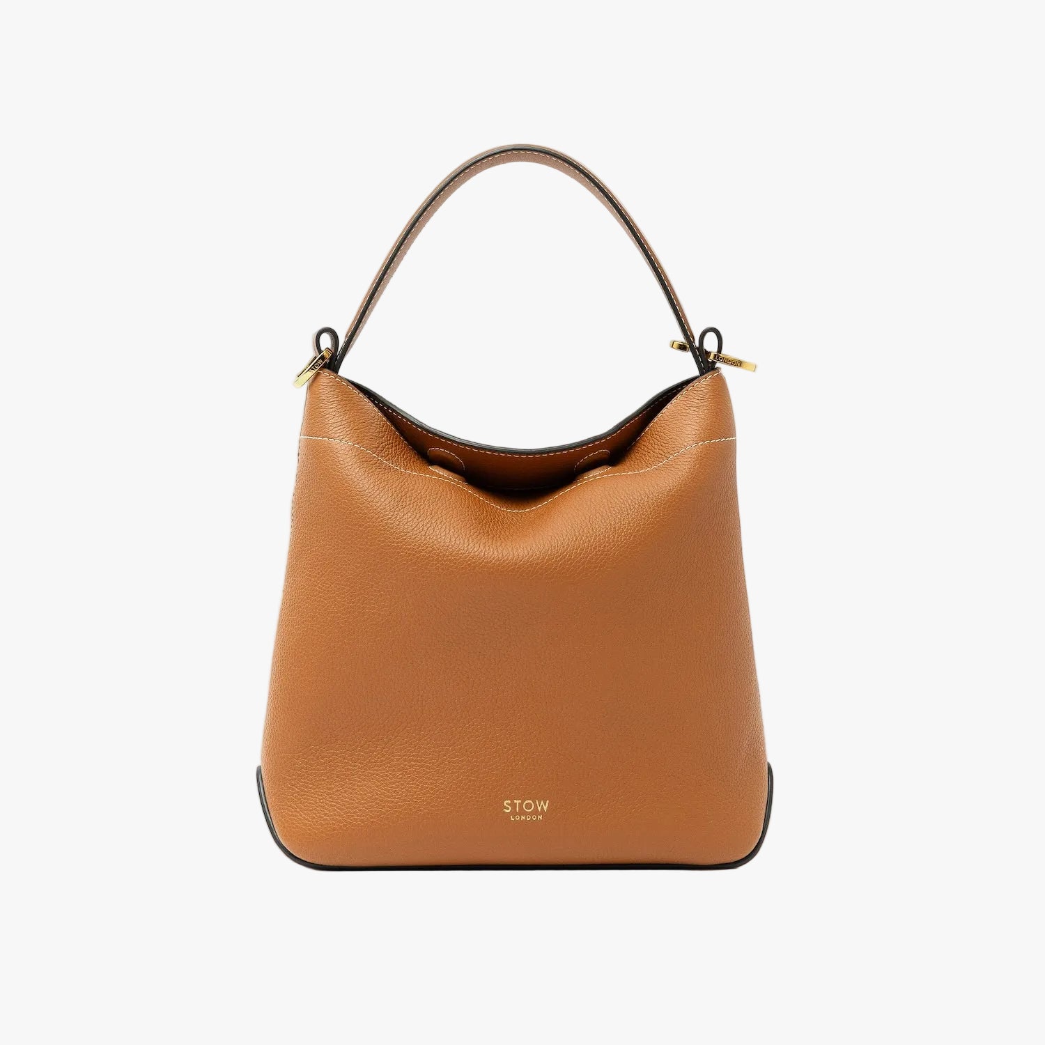 STOW London's Midi Curve in Earth Tan pebbled leather styled as a flap bag featuring gold-coated stainless steel hardware on a light grey background