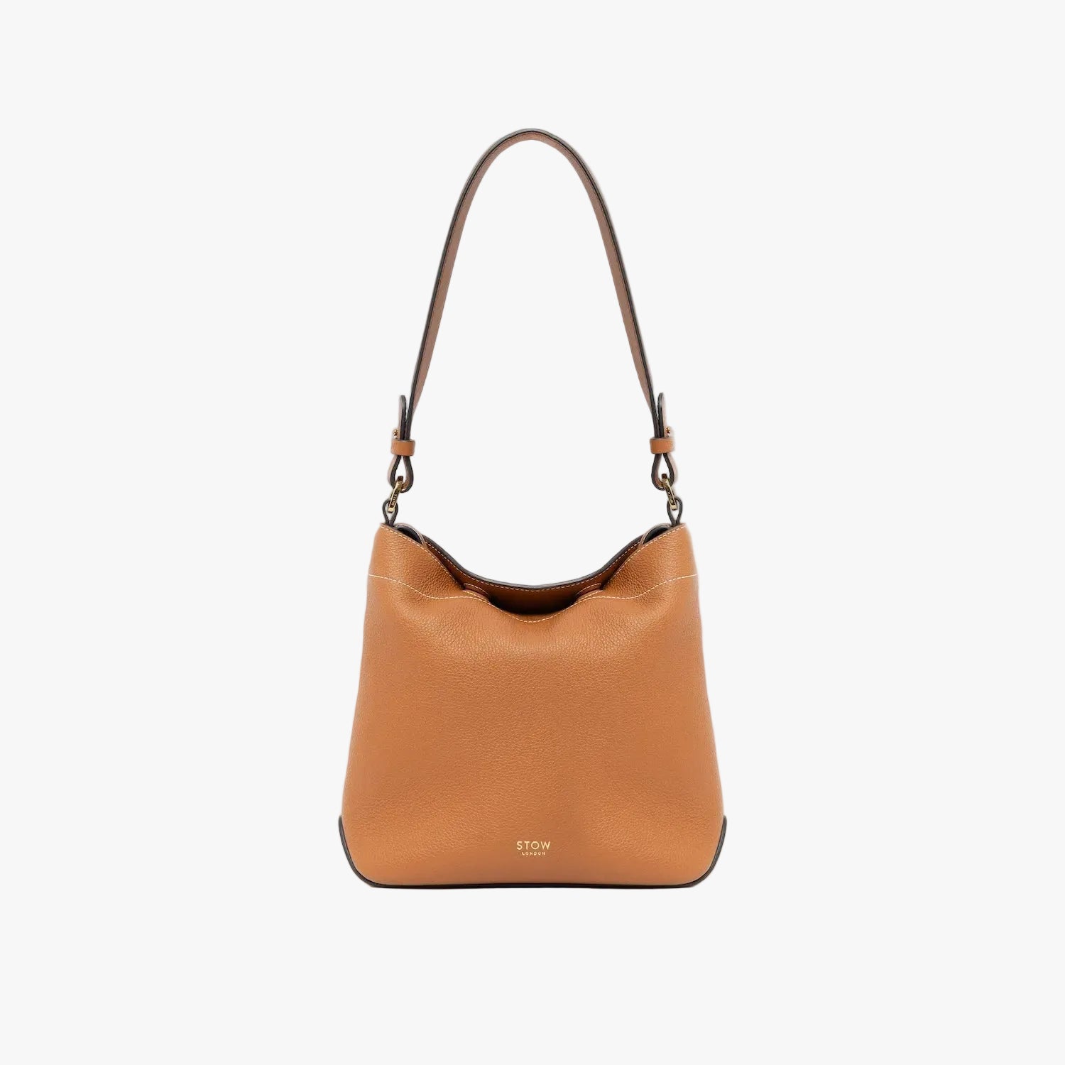 STOW London's Midi Curve in Earth Tan leather with the detachable shoulder strap on a light grey background featuring gold details