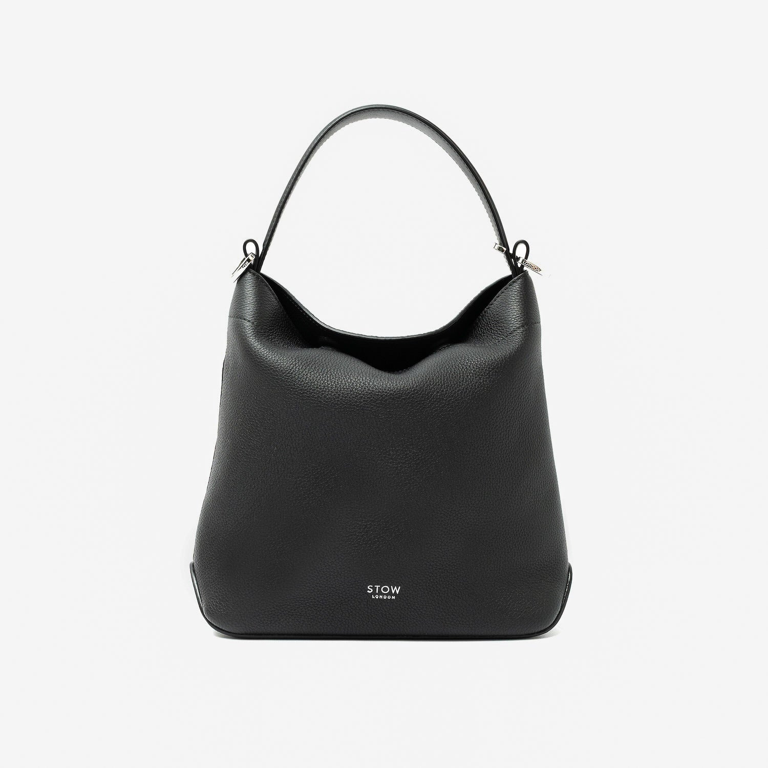 STOW London's Midi Curve in Black pebbled leather styled as a flap bag featuring silver stainless steel hardware on a light grey background