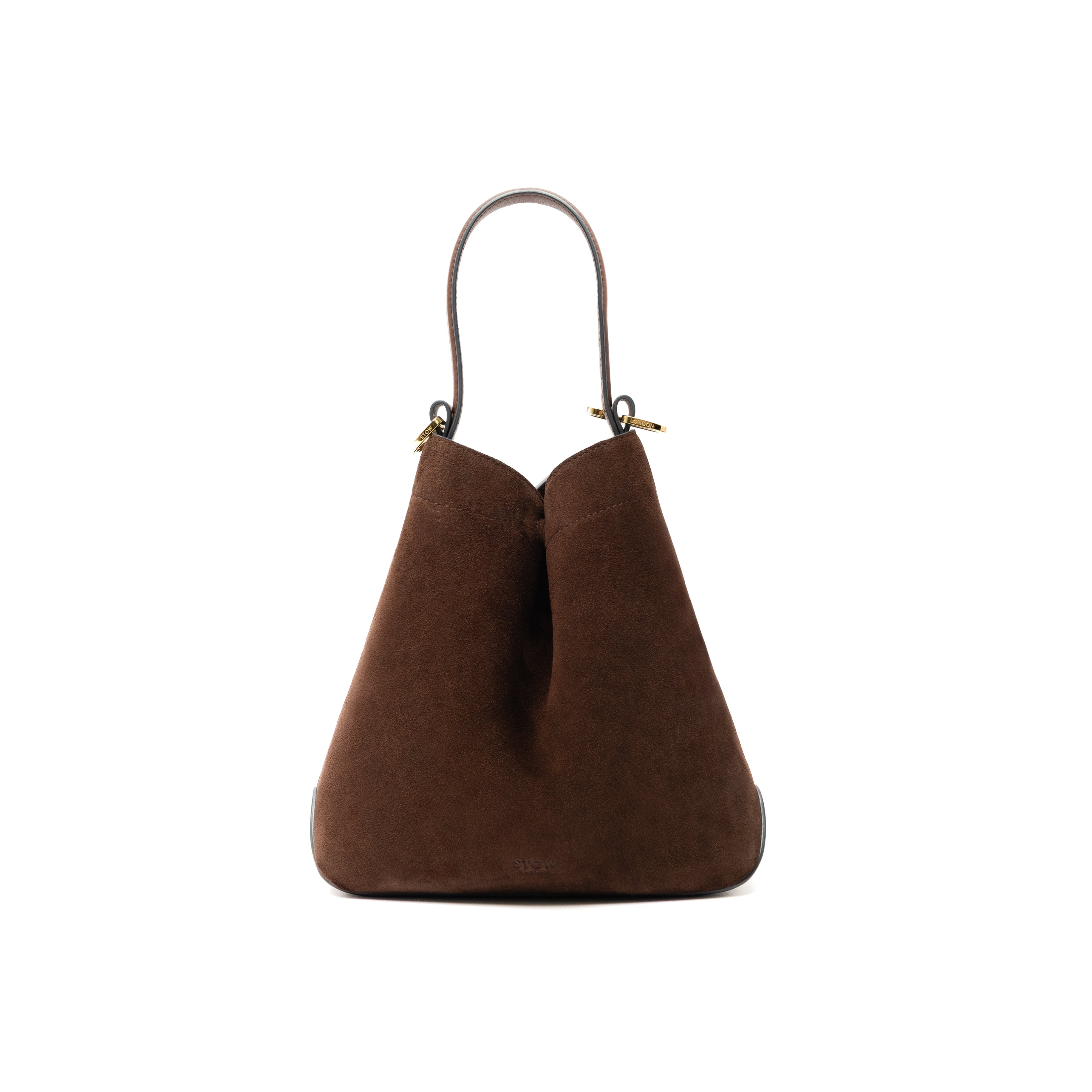 STOW London's Midi Curve bag in Chocolate Suede leather styled in the triangular form featuring gold-coated stainless steel hardware on a white background