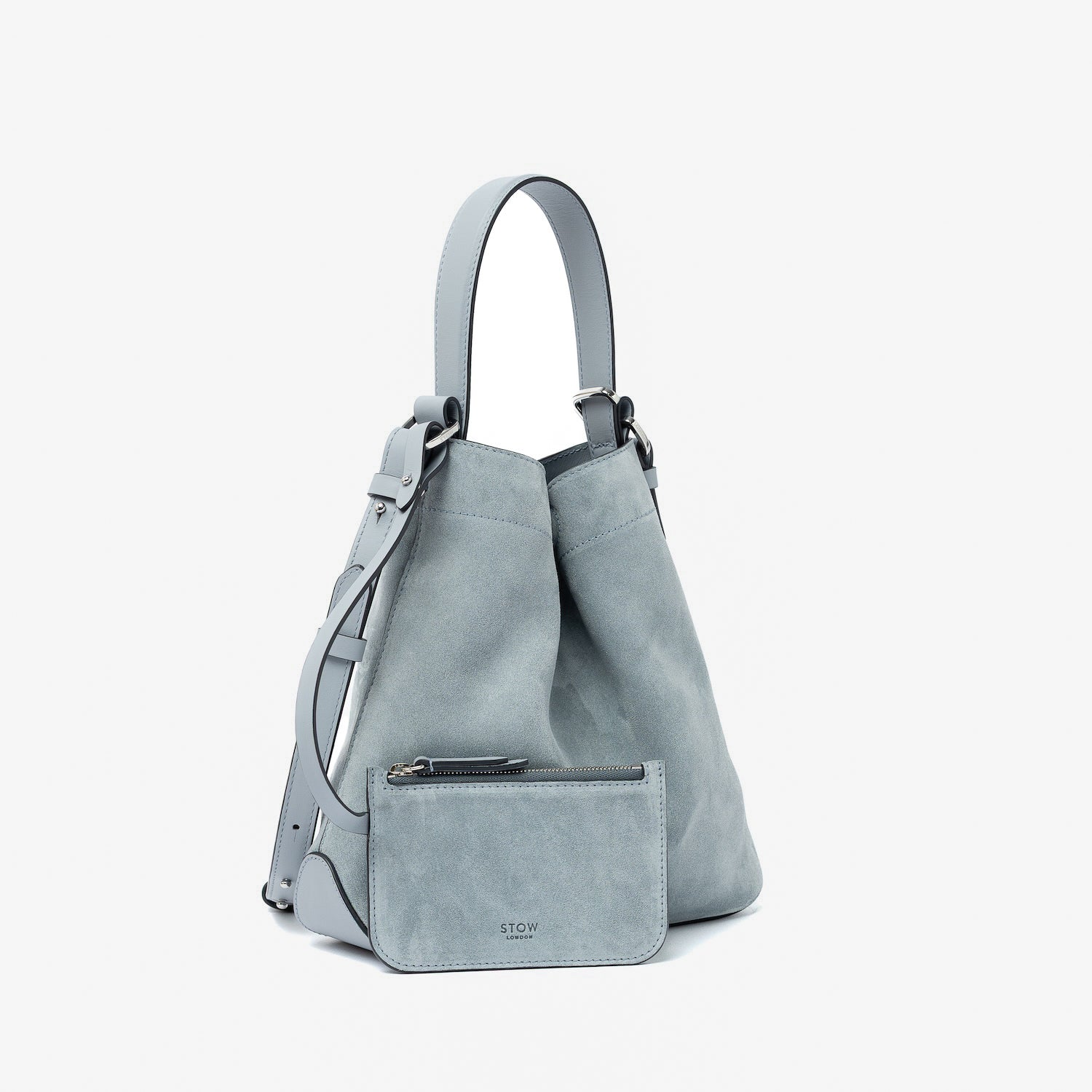 STOW London's Midi Curve in Misty Blue suede leather and matching, detachable interior pouch featuring silver stainless steel hardware on a light grey background