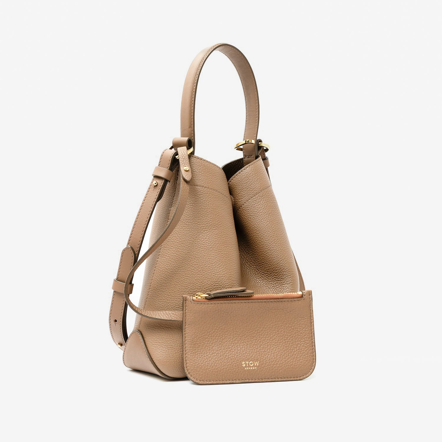 STOW London's Midi Curve in Mocha pebbled leather with its matching, detachable interior pouch featuring gold-coated stainless steel hardware on a light grey background