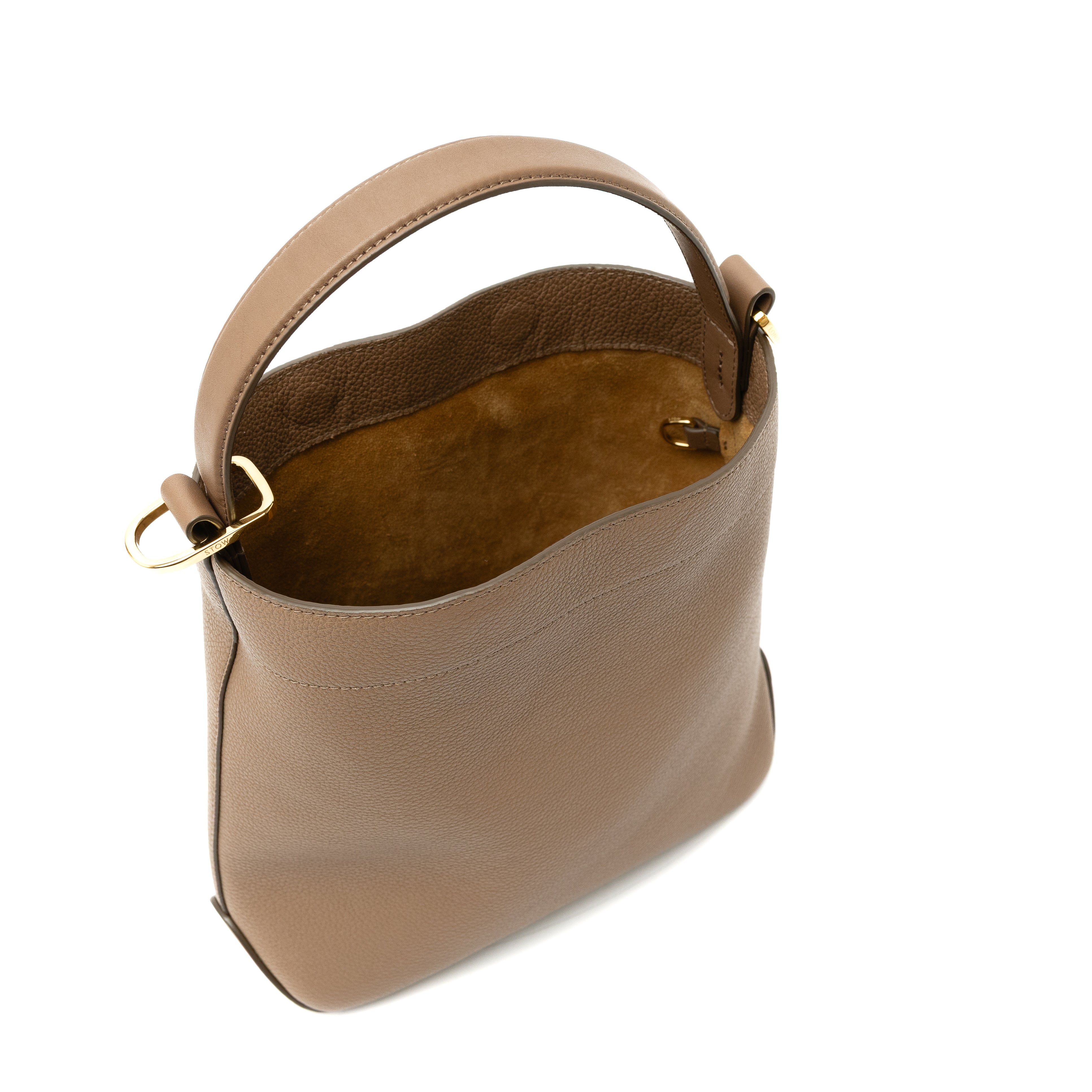 Top angled view of STOW London's Midi Curve bag in Mocha pebbled and smooth leather with bag open showing interior d-ring featuring gold-coated stainless steel hardware on a white background