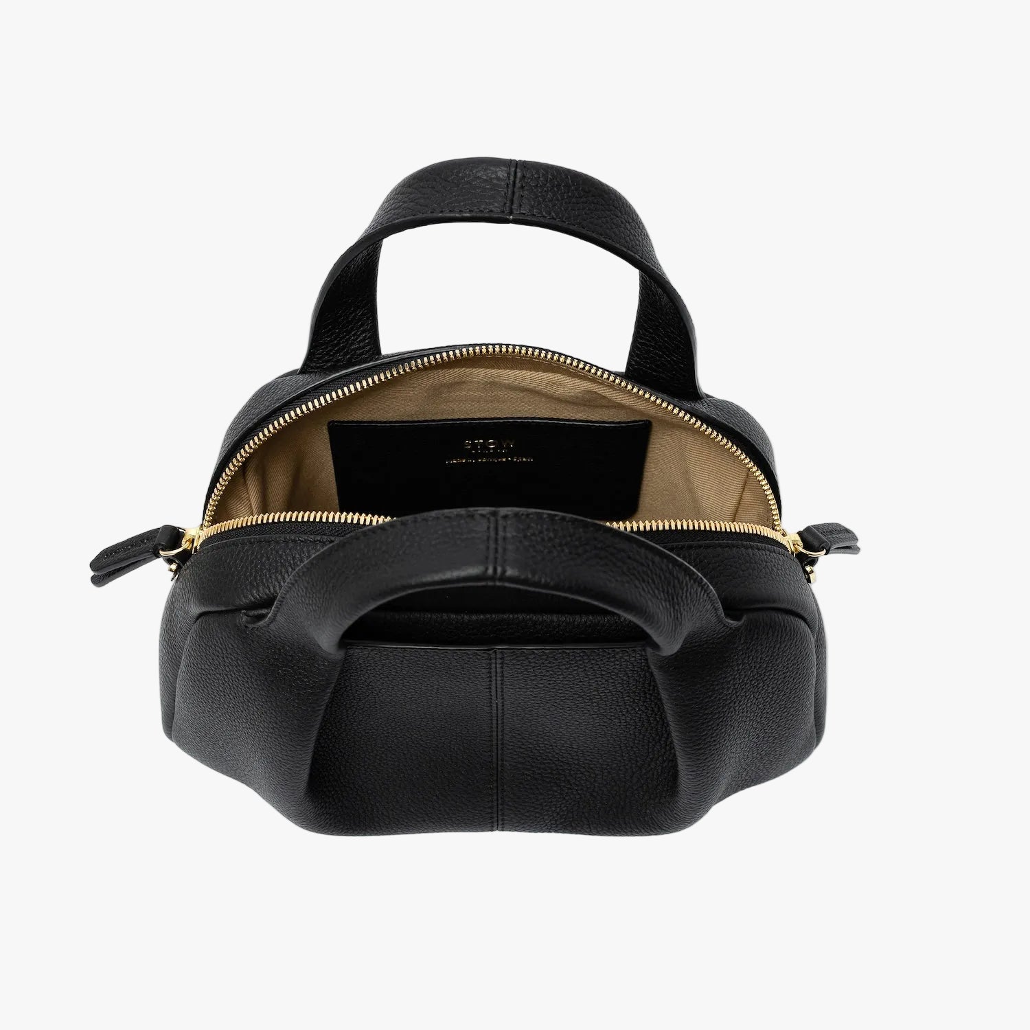 STOW London's Mini Bowling bag in Black pebbled leather with zips open showing the light beige interior lining and slip pocket featuring gold-coated stainless steel hardware on a light grey background