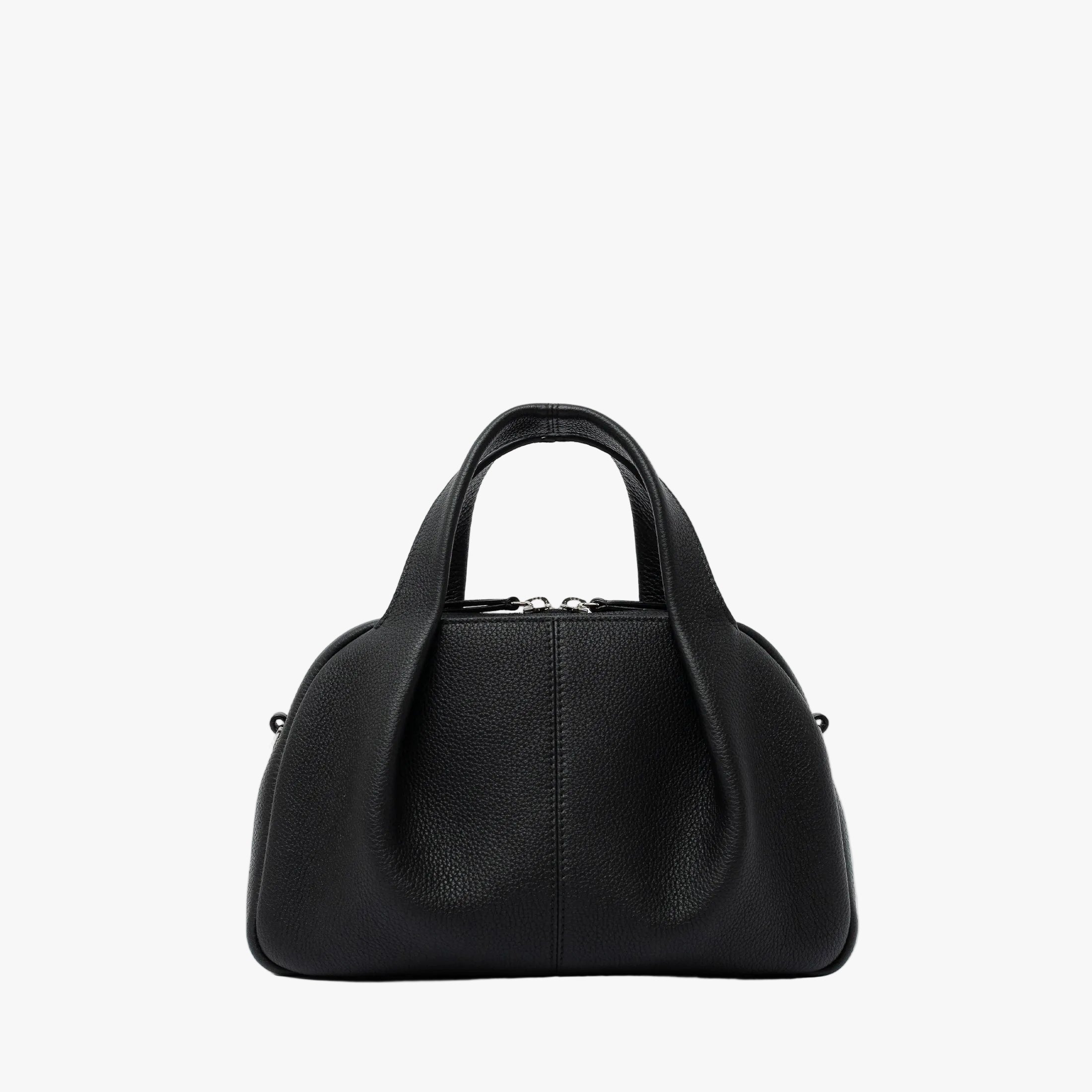 STOW London's Mini Bowling bag in Black pebbled leather featuring a pleated front panel and silver stainless steel hardware on a light grey background