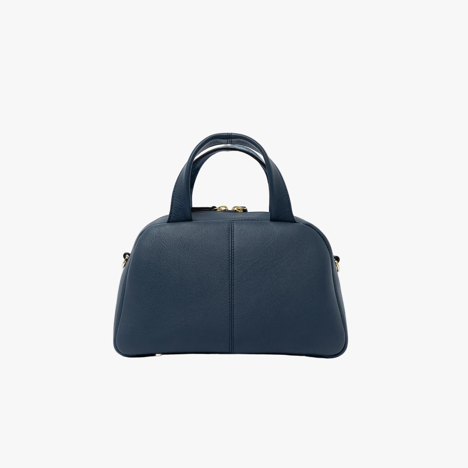 Shot of the smooth leather back panel of STOW London's Mini Bowling bag in Navy featuring gold-coated stainless steel hardware and four feet on the base on a light grey background