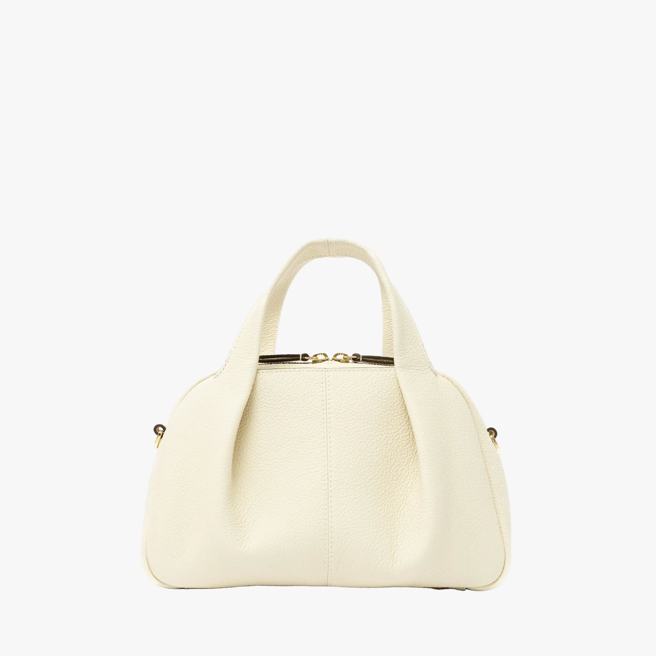 STOW London's Mini Bowling bag in Spring Moon pebbled leather featuring a pleated front panel and gold-coated stainless steel hardware on a light grey background