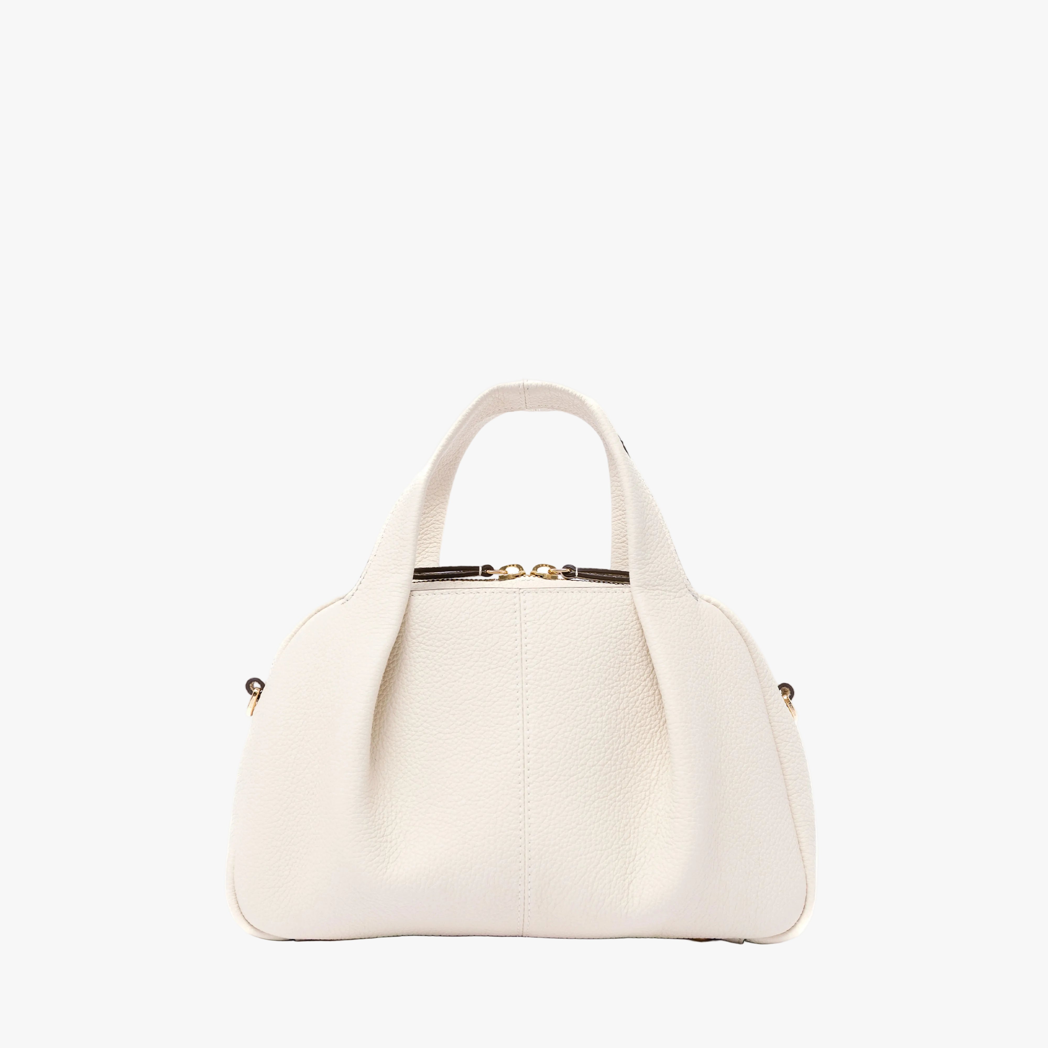 STOW London's Mini Bowling bag in Spring Moon pebbled leather featuring a pleated front panel and gold-coated stainless steel hardware on a light grey background
