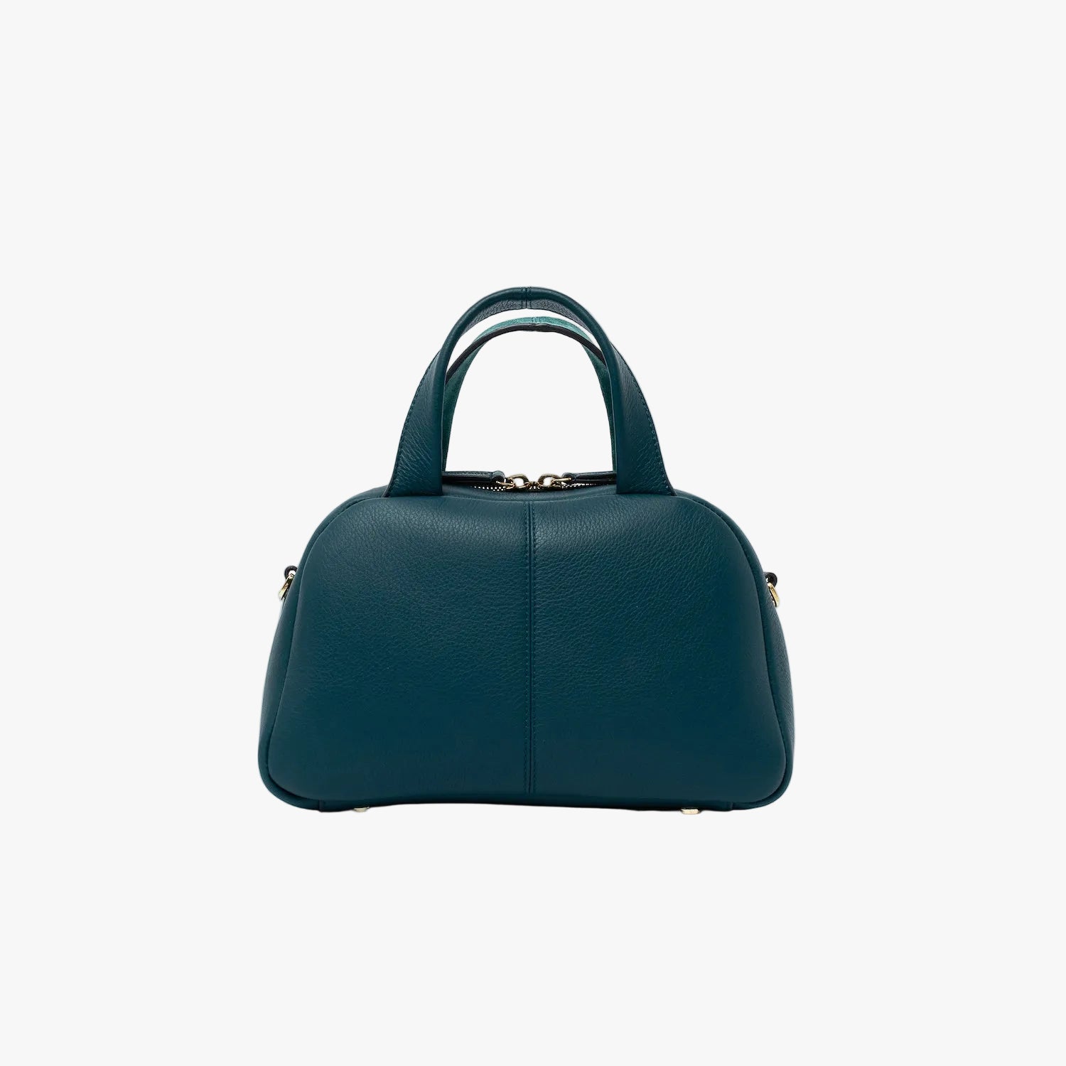 Smooth leather back panel of STOW London's Mini Bowling bag in Ocean Teal leather featuring four feet on the base and gold-coated stainless steel hardware on a light grey background