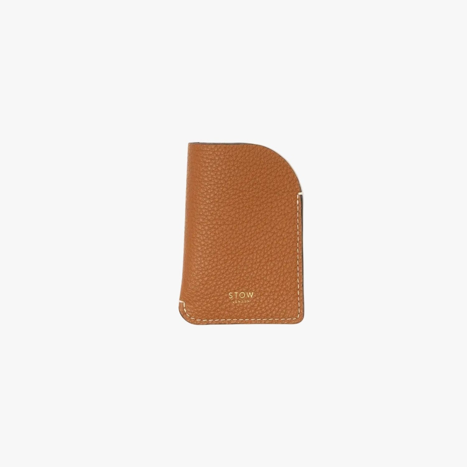 STOW London's Mini Cardholder in Earth Tan pebbled leather on a light grey background featuring a small gold embossed logo on the front bottom