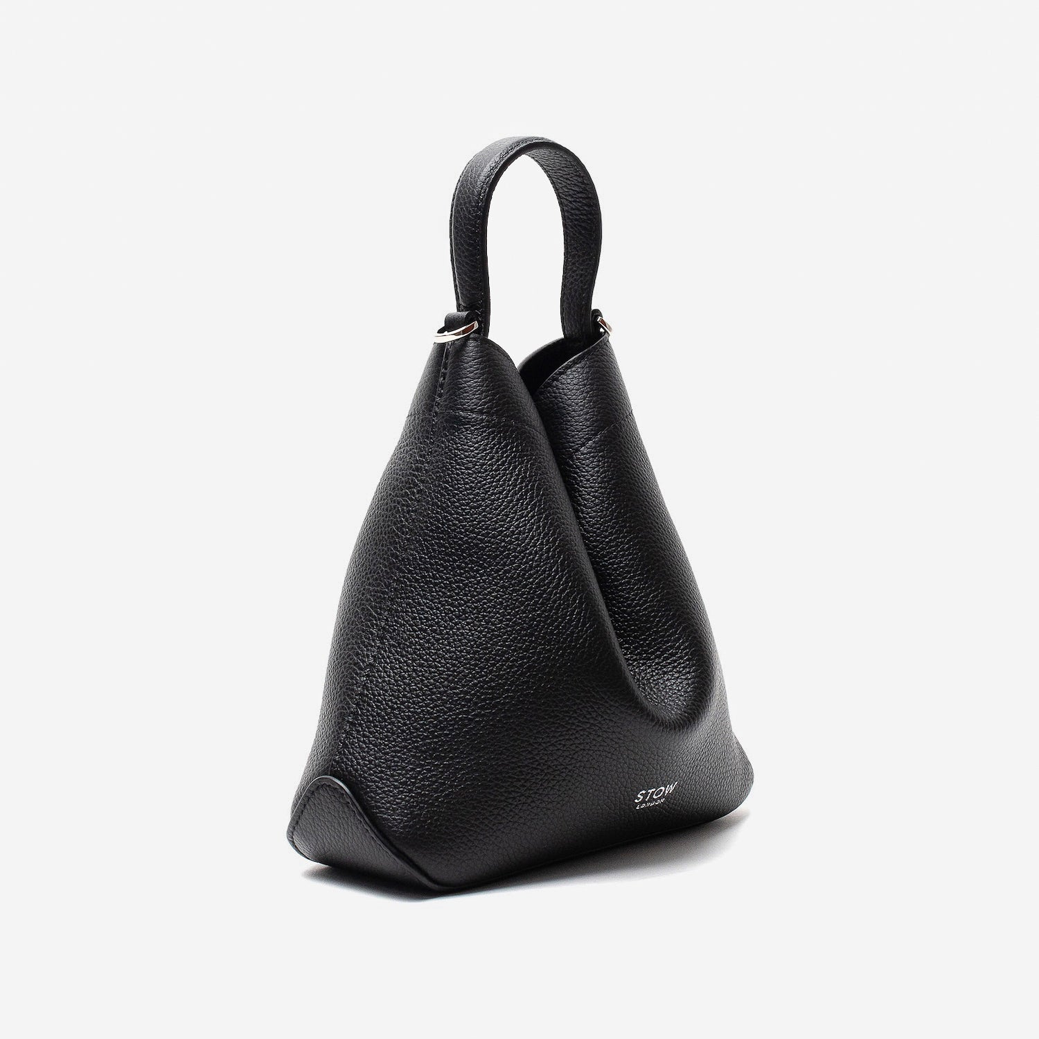Off-axis view of Stow London's Mini Curve in Black pebbled leather featuring silver hardware on a light grey background