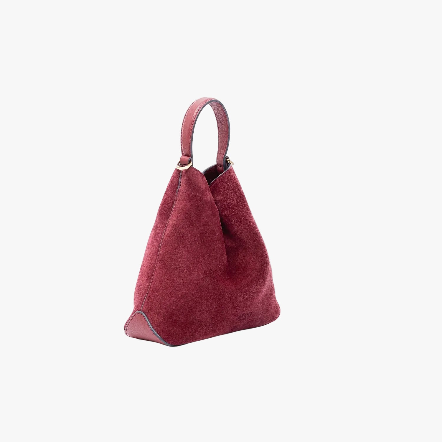 Off-axis view of Stow London's Mini Curve in Burgundy suede leather on a light grey background