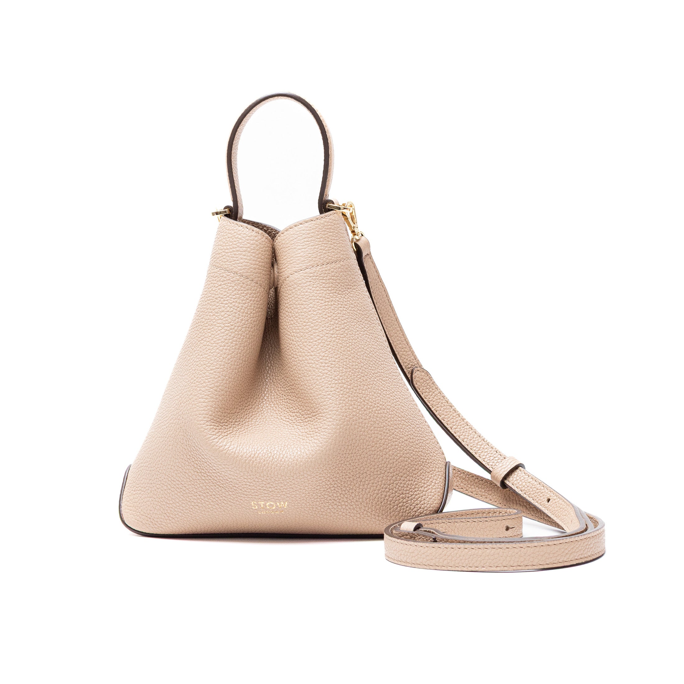 STOW London's Mini Curve and leather crossbody strap in Camel featuring gold-coated stainless steel hardware on a white background
