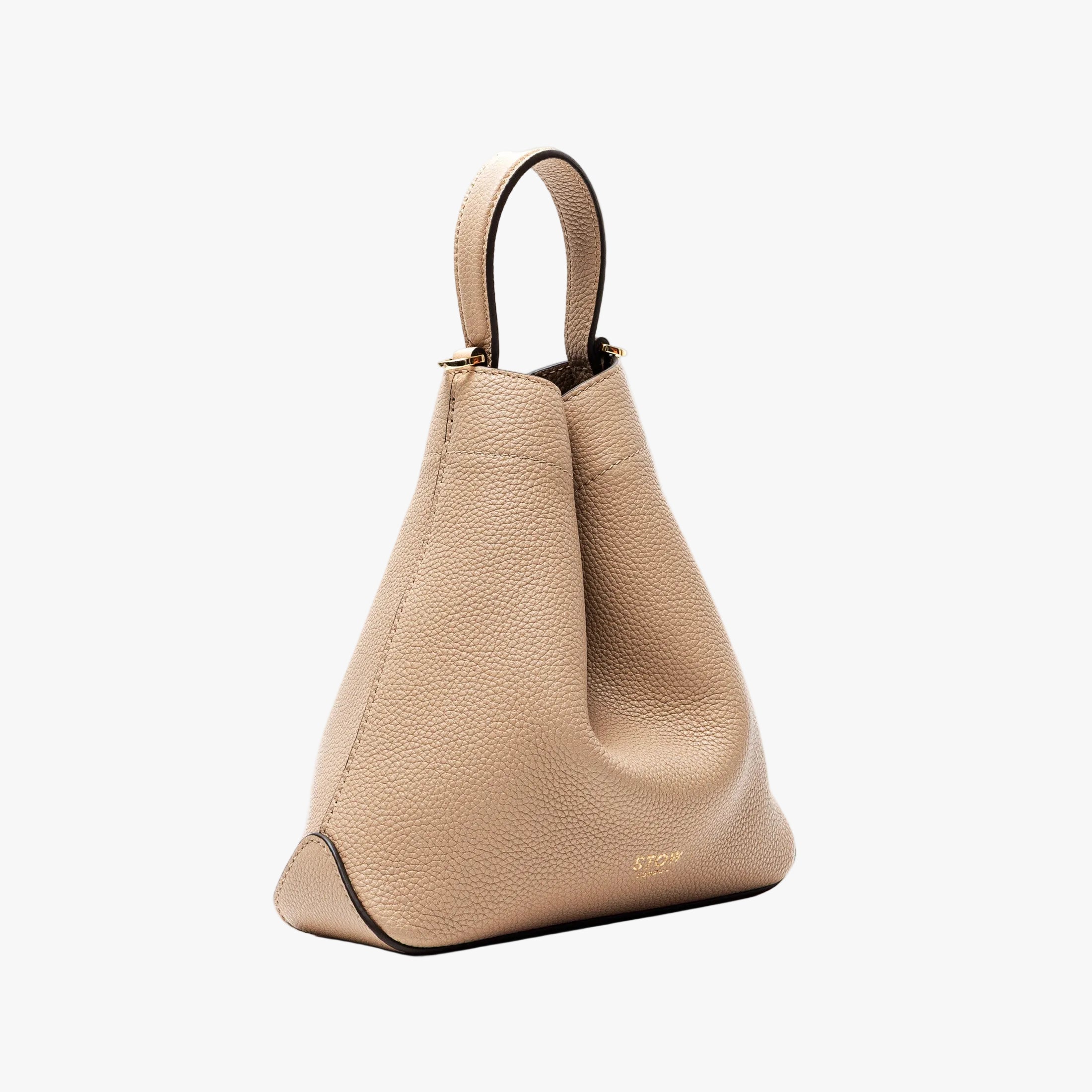 Off-axis view of STOW London's Mini Curve in Camel pebbled leather on a light grey background
