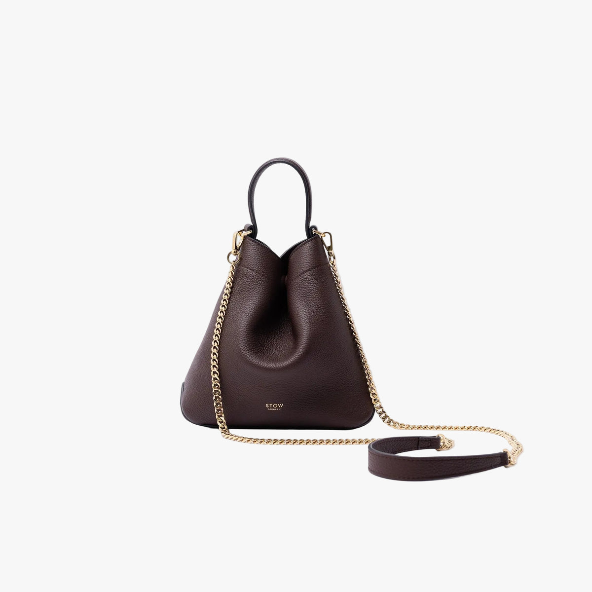 STOW London's Mini Curve in Espresso pebbled leather on a light grey background featuring the detachable gold chain strap