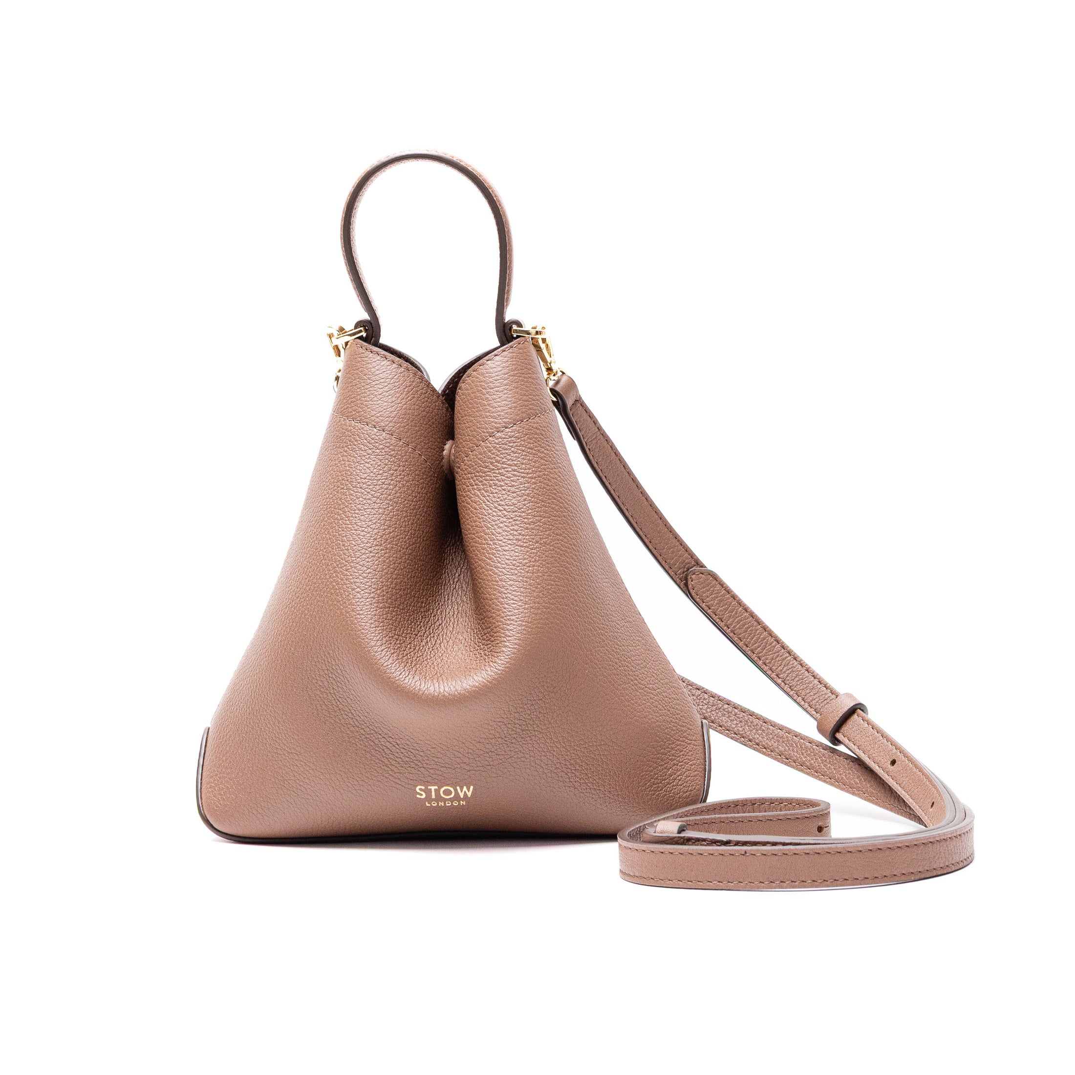 Front view of STOW London's Mini Curve in Mocha pebbled and smooth leather with detachable crossbody leather strap featuring gold-coated stainless steel hardware on a white background