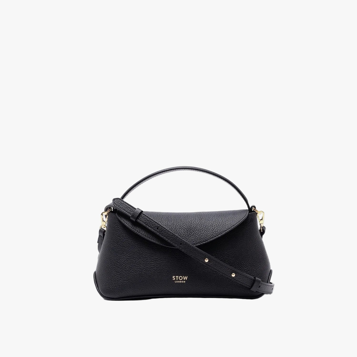 STOW London's Mini East West in Black pebbled leather and detachable crossbody strap featuring gold-coated stainless steel hardware on a light grey background