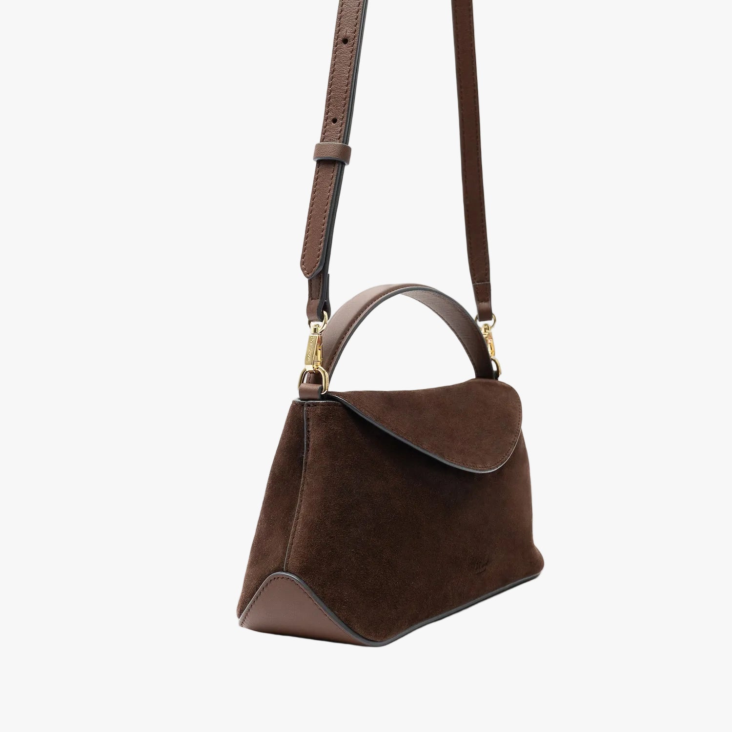 Off-axis view of STOW London's Mini East West in Chocolate suede leather and detachable crossbody strap featuring gold-coated stainless steel hardware on a light grey background