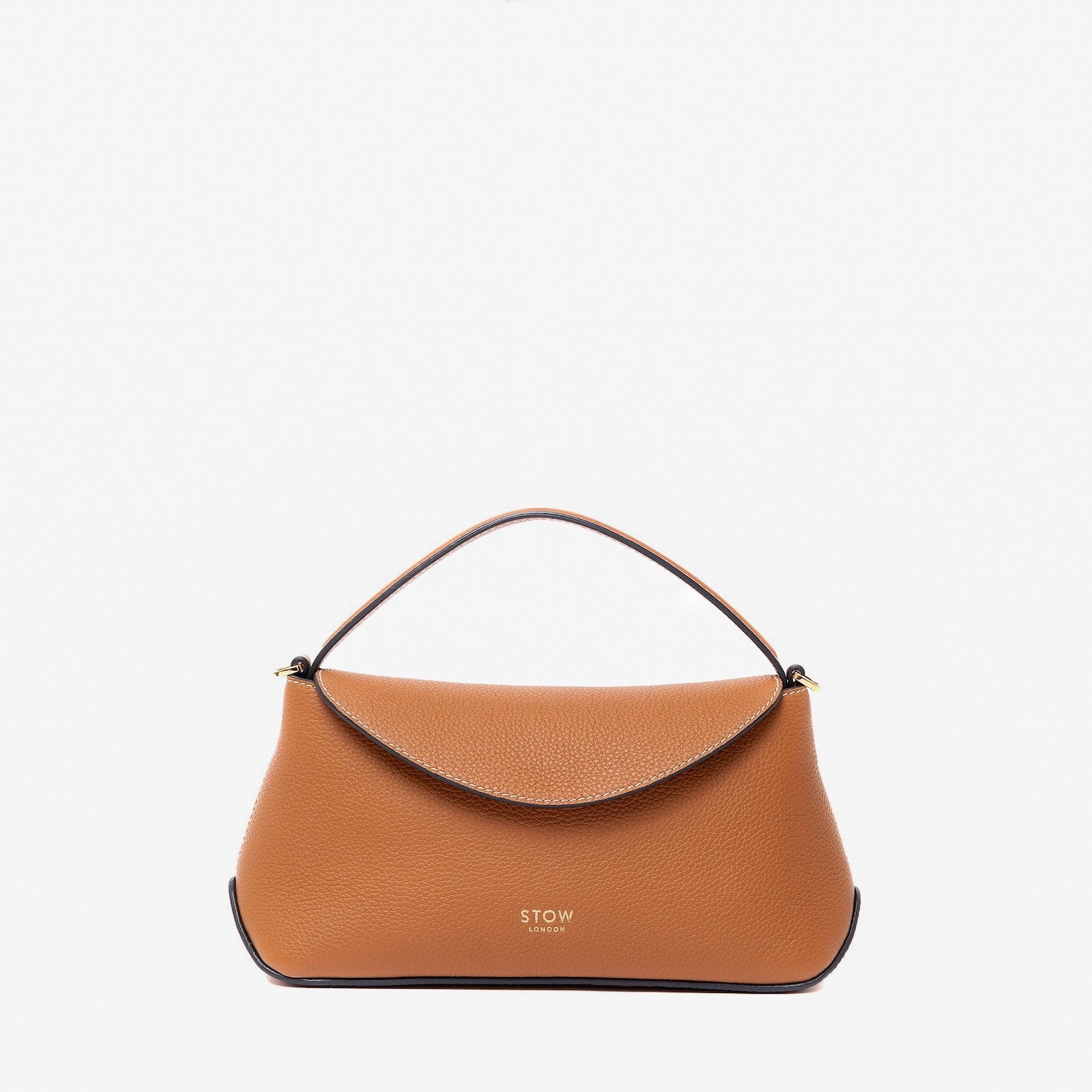 STOW London's Mini East West in Earth Tan pebbled leather featuring gold-coated stainless steel hardware on a light grey background