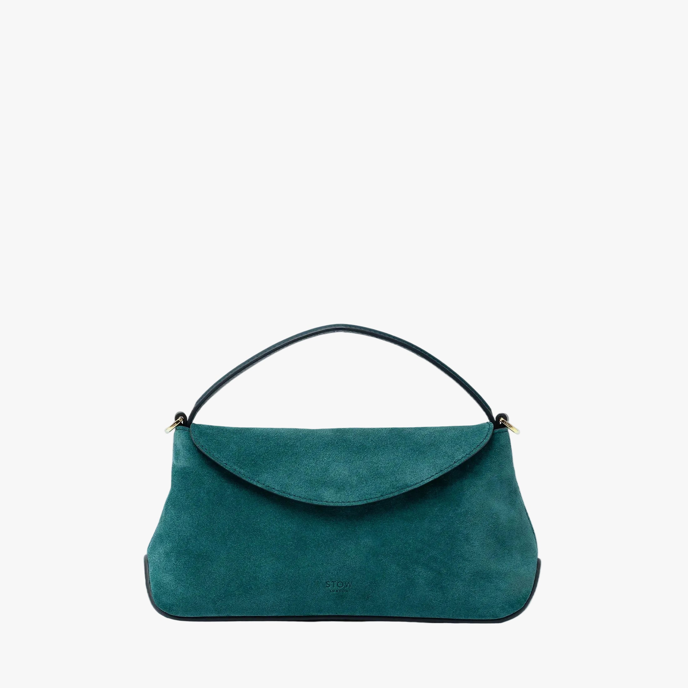 STOW London's Mini East West in Ocean Teal suede leather featuring gold-coated stainless steel hardware on a light grey background