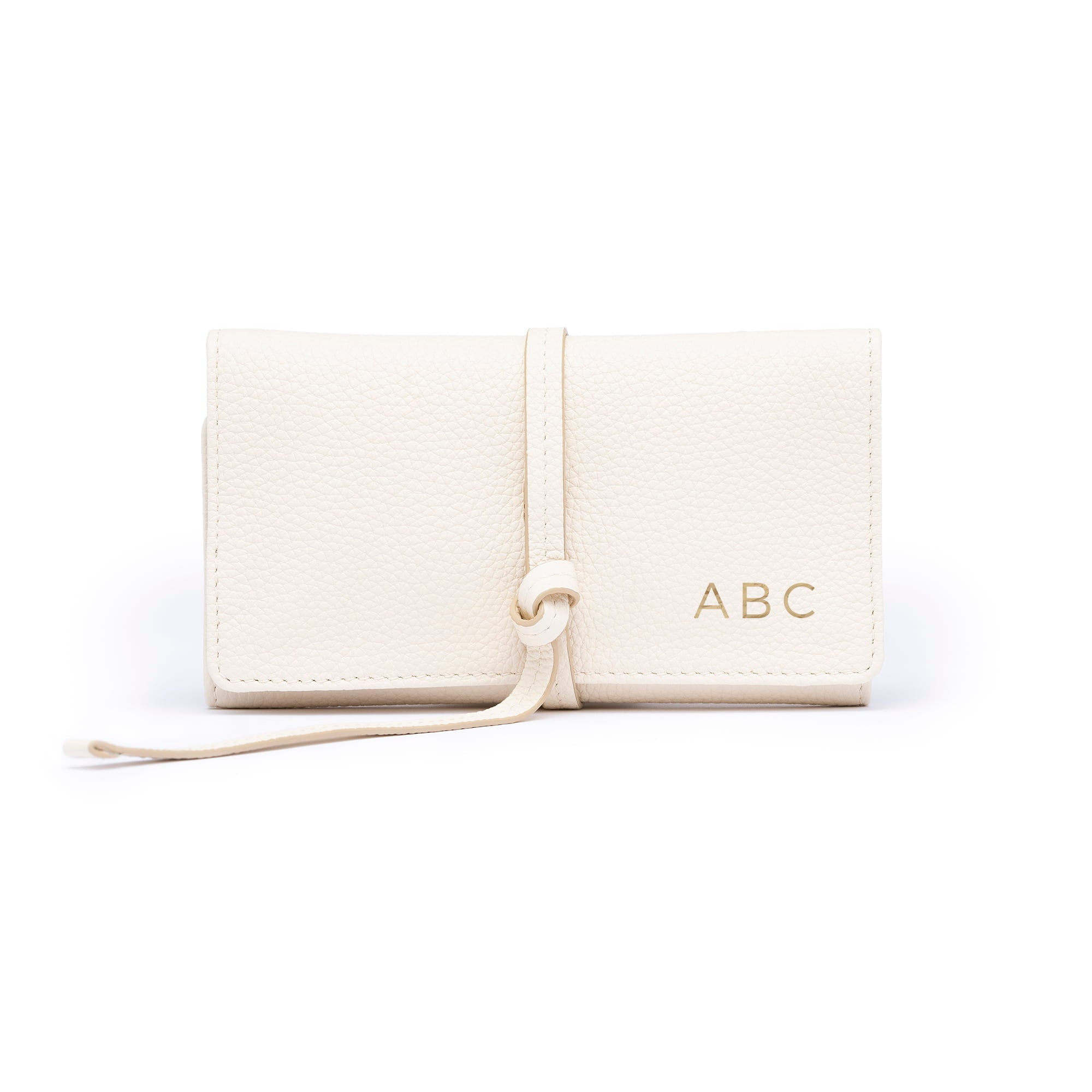 STOW London Mini Jewellery Roll in Spring Moon leather with personalised initials on flap.